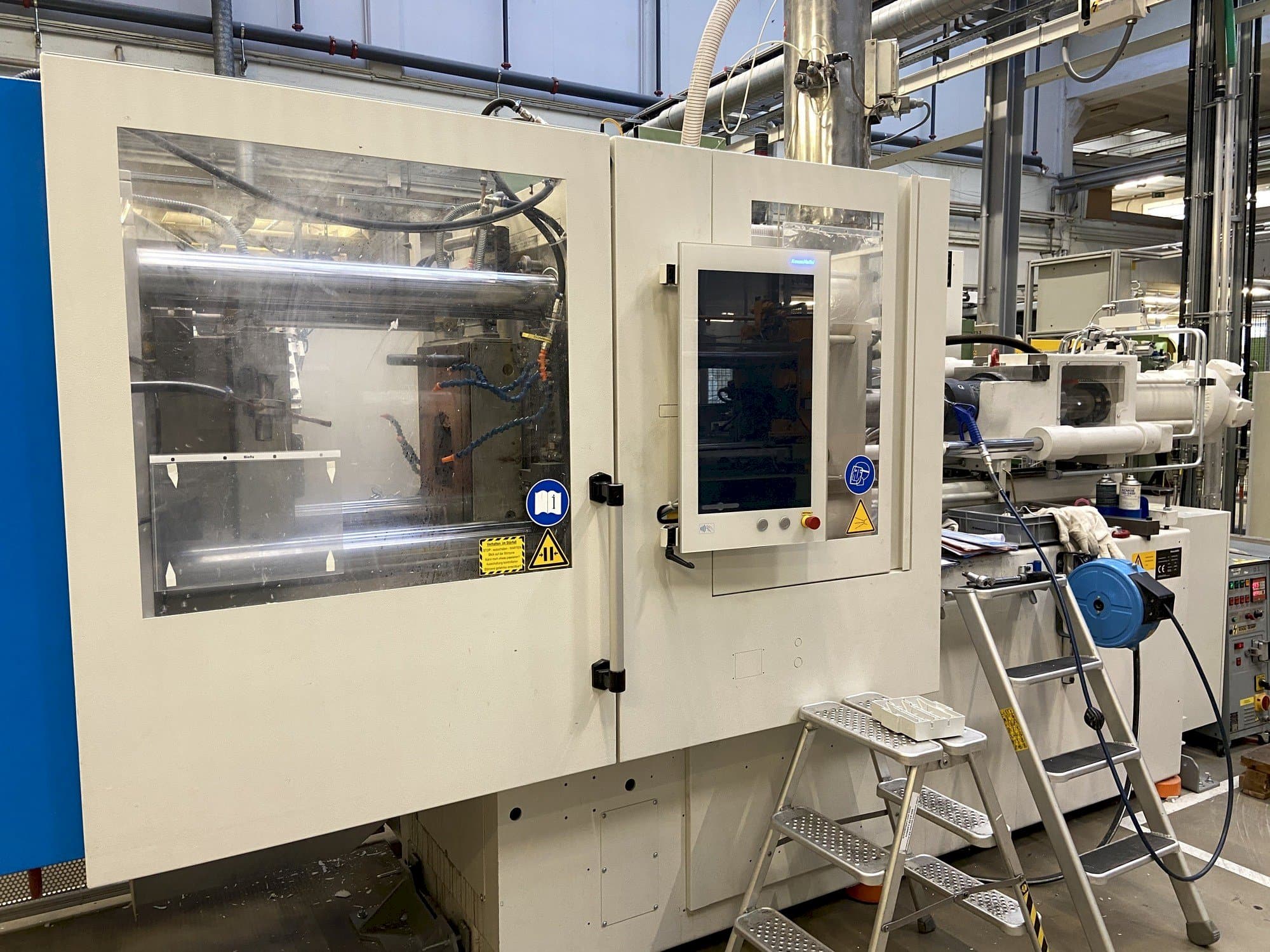 Mašīnas Krauss Maffei 130-1000 CX DUR pretskats