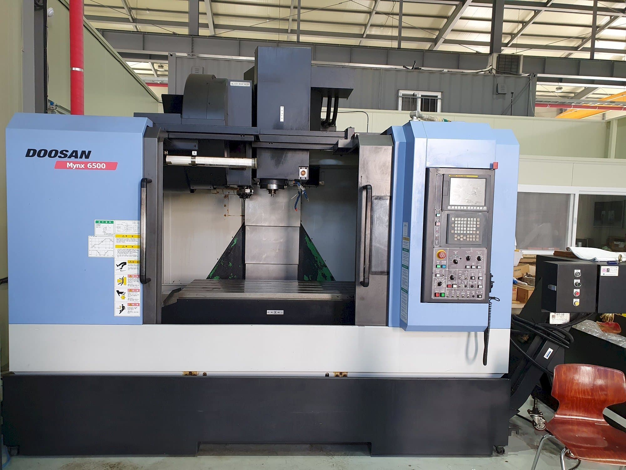 Mašīnas Doosan MYNX 6500 pretskats