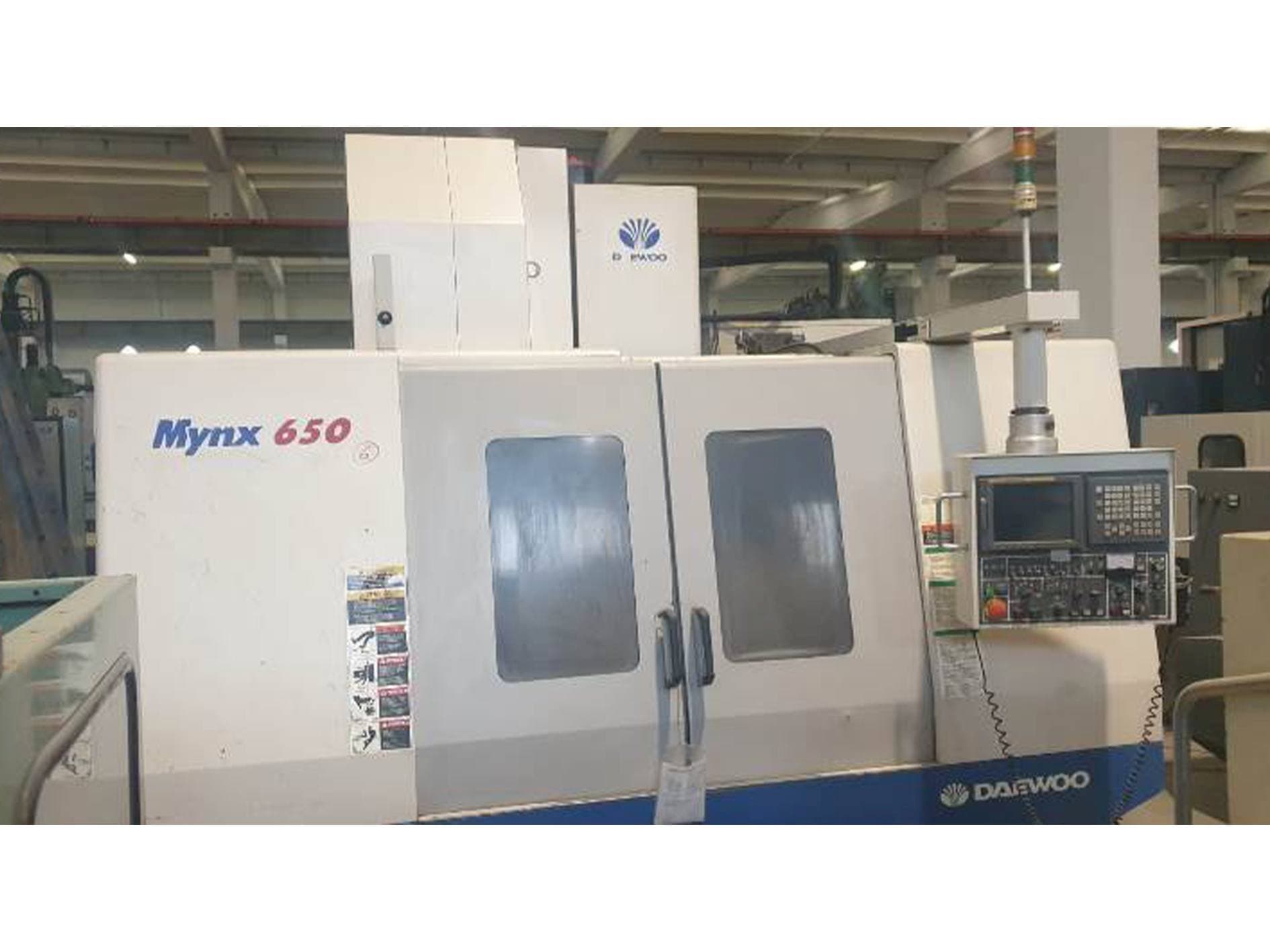 Mašīnas DAEWOO MYNX 650 pretskats