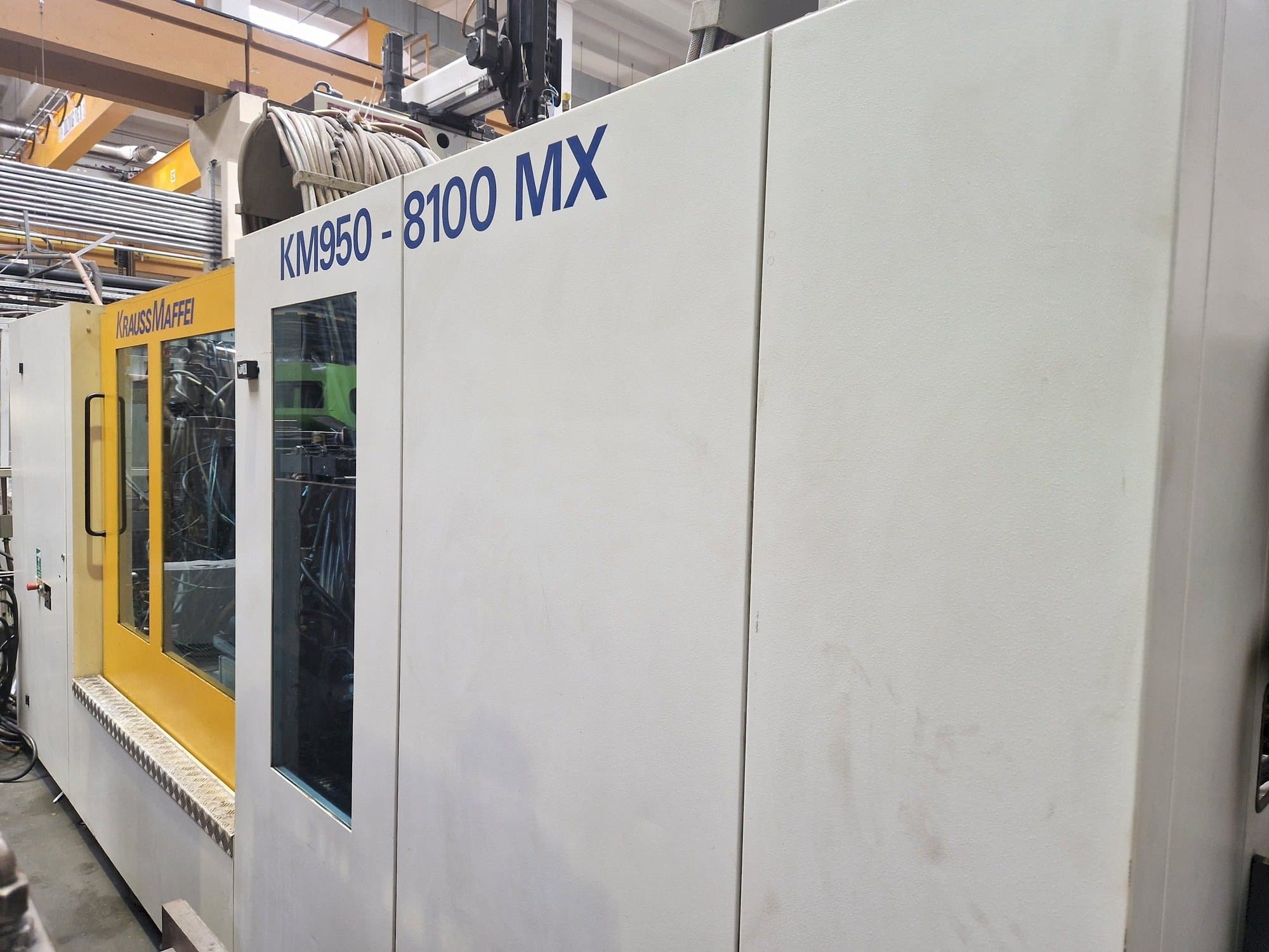 Mašīnas Krauss Maffei 950-8100 MX pretskats