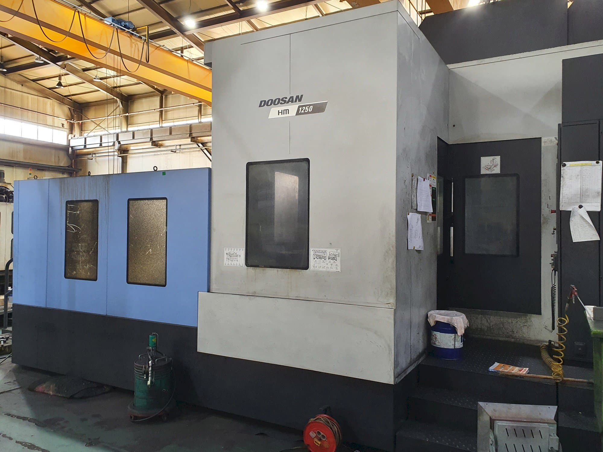 Mašīnas Doosan HM 1250 pretskats
