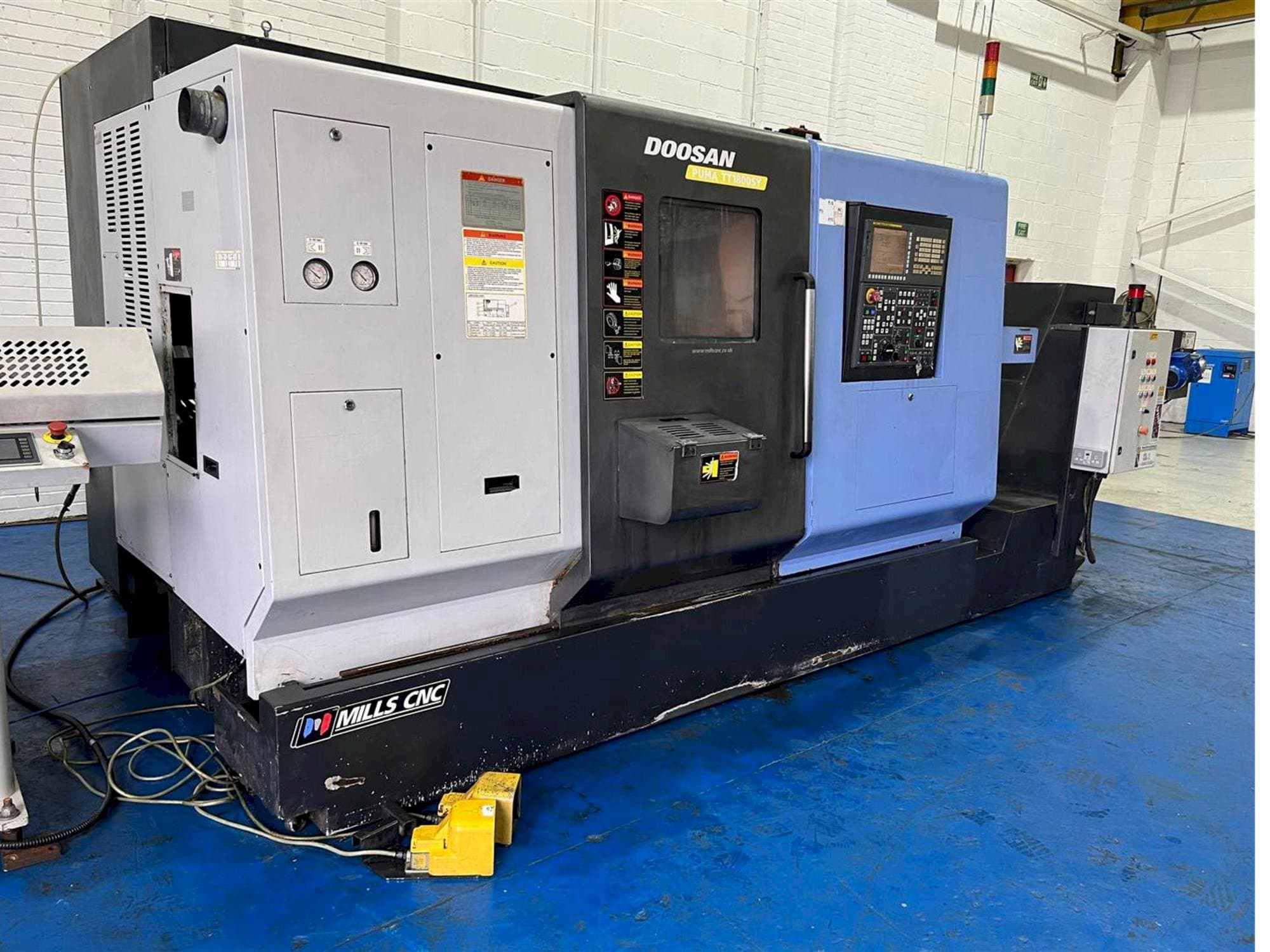 Mašīnas Doosan TT1800SY pretskats