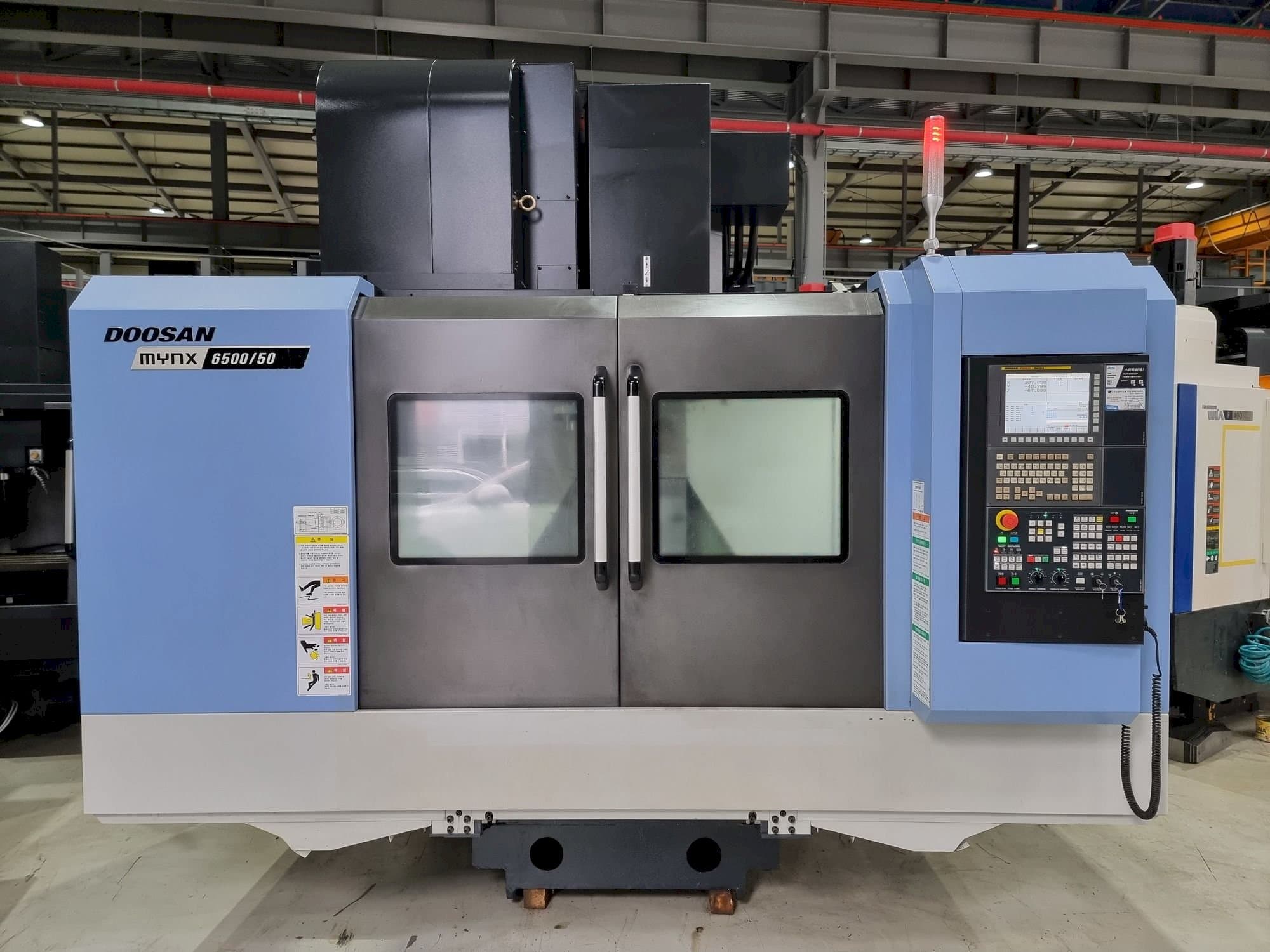 Mašīnas Doosan MYNX 6500/50 pretskats