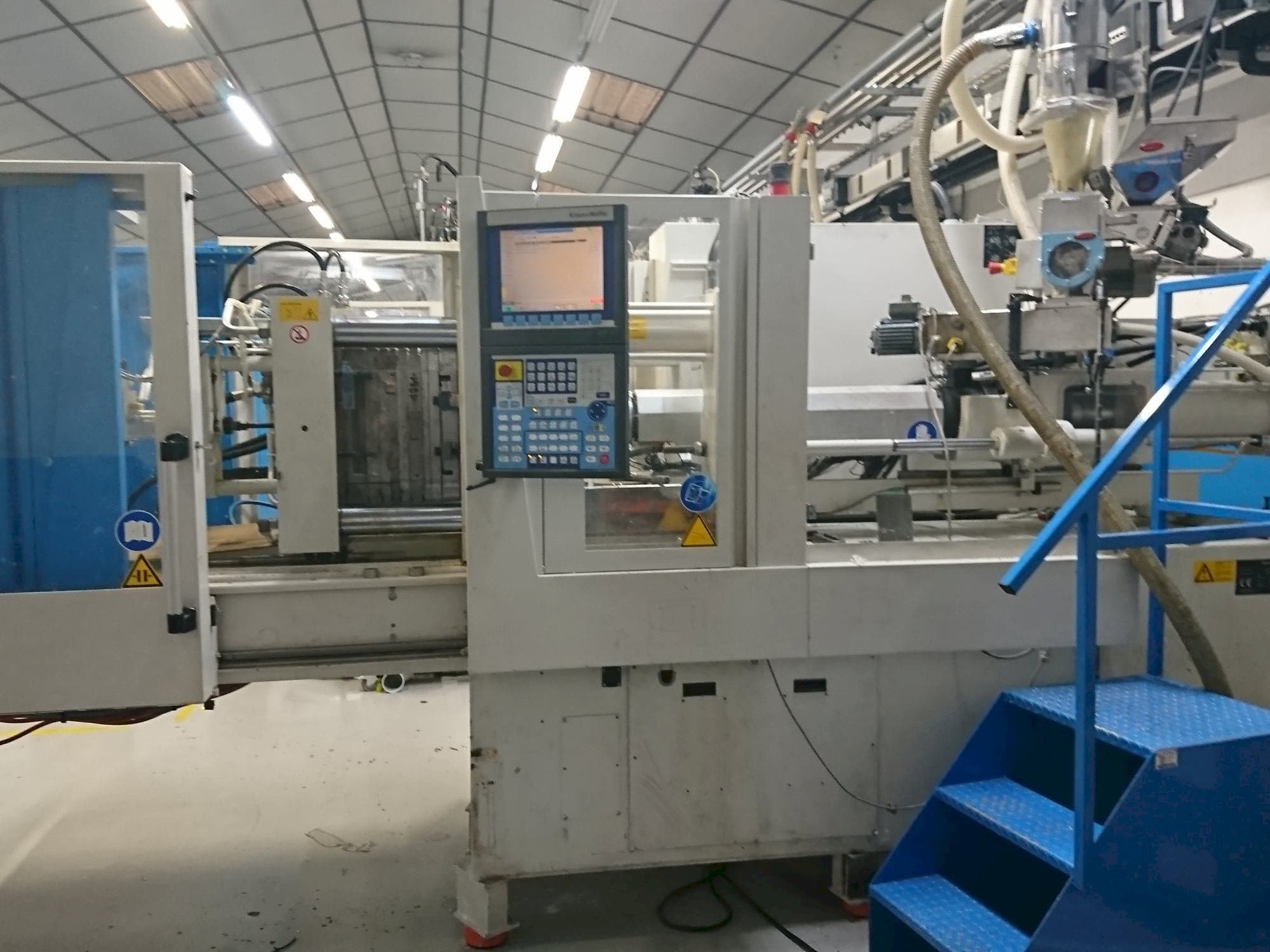 Mašīnas Krauss Maffei 80-750 CX pretskats