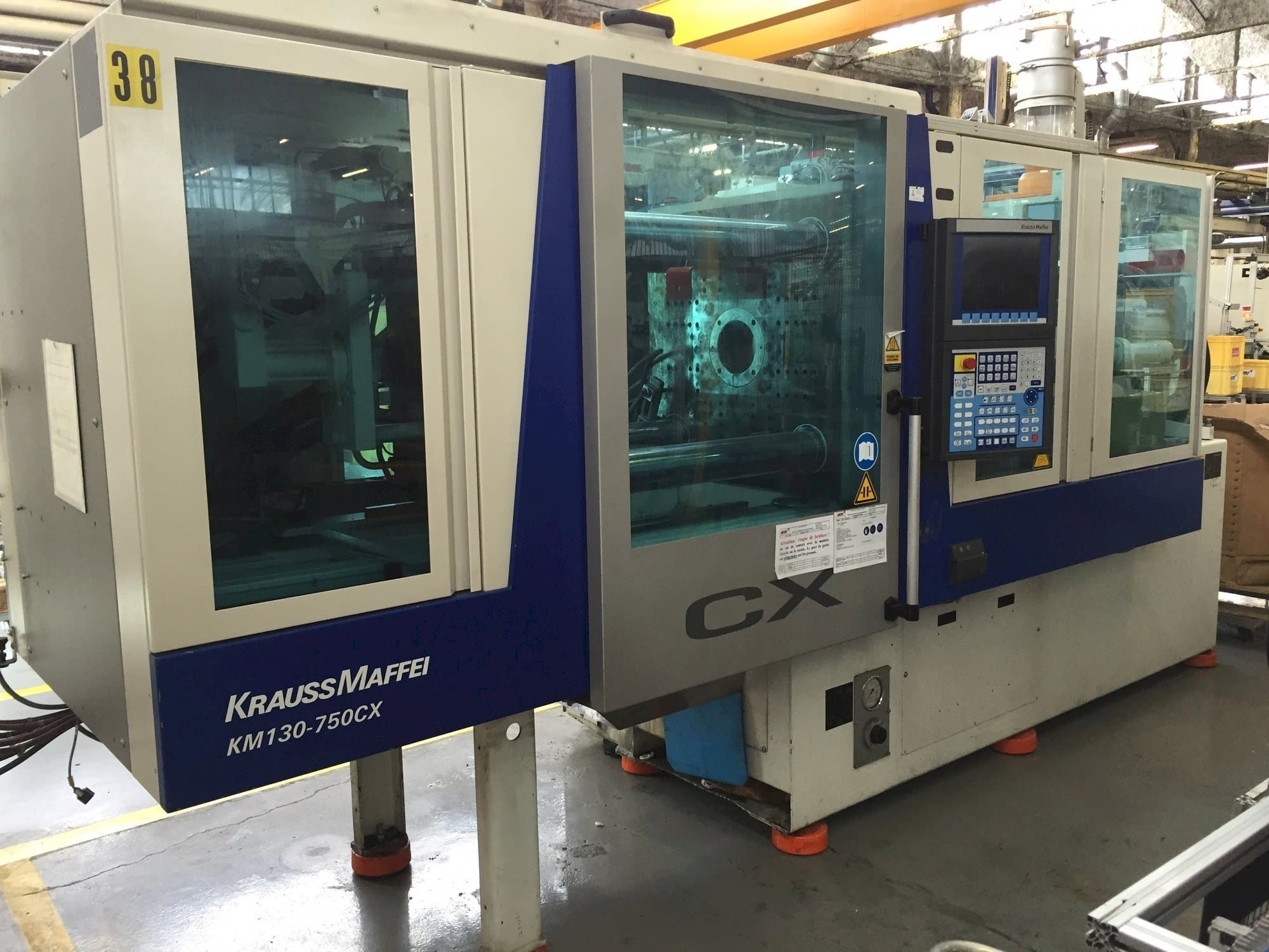Mašīnas Krauss Maffei 130-750 CX  pretskats
