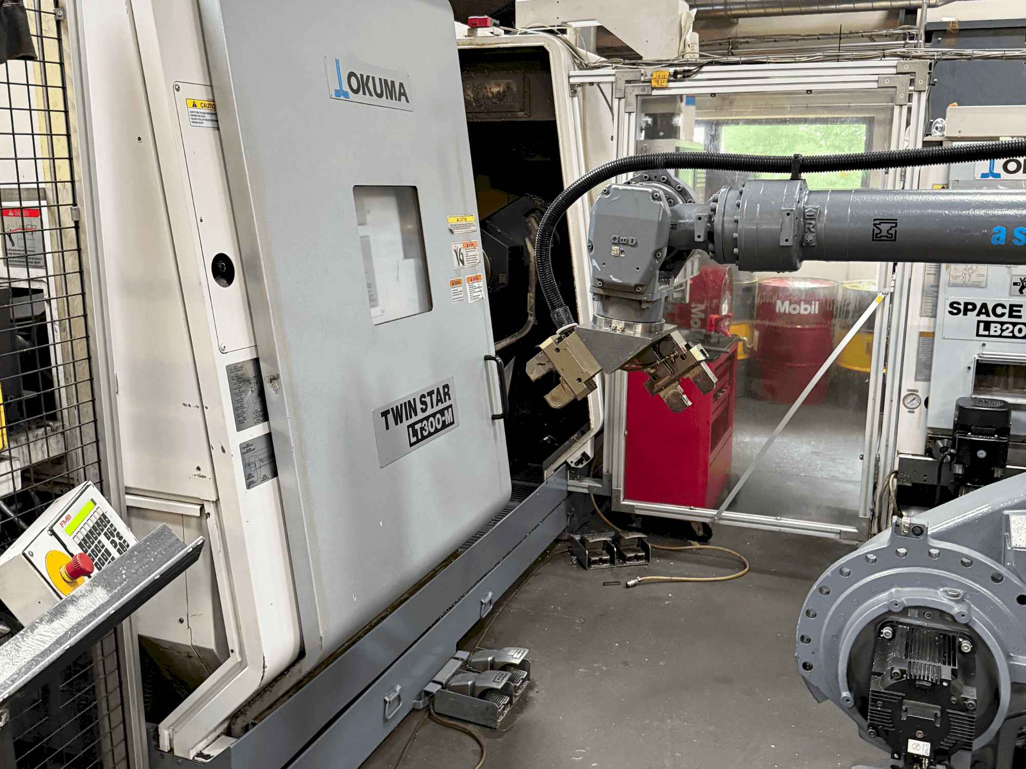 Mašīnas Okuma Twinstar LT300-M pretskats