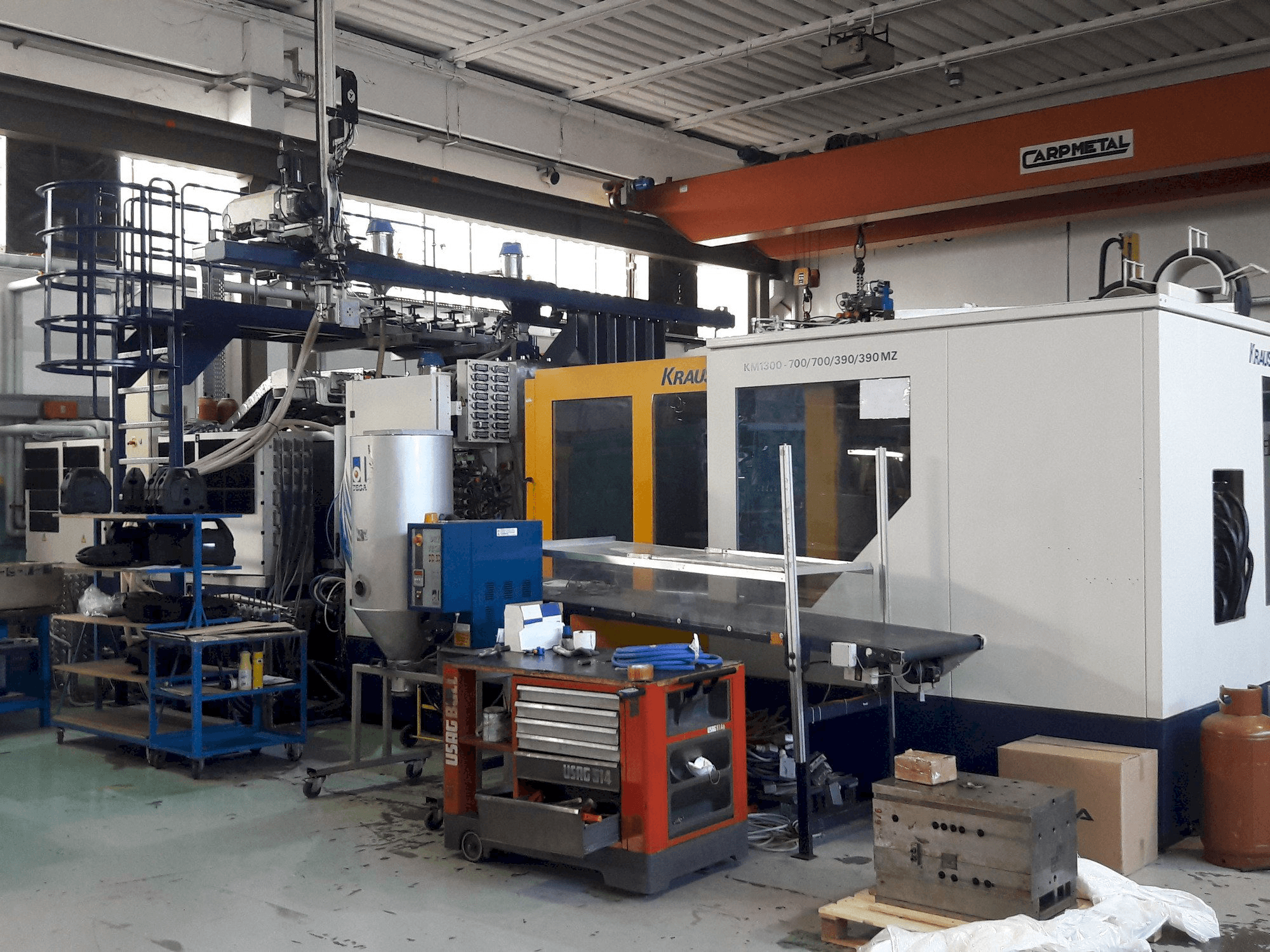 Mašīnas Krauss Maffei 1300-700-700-390-390 MZ pretskats