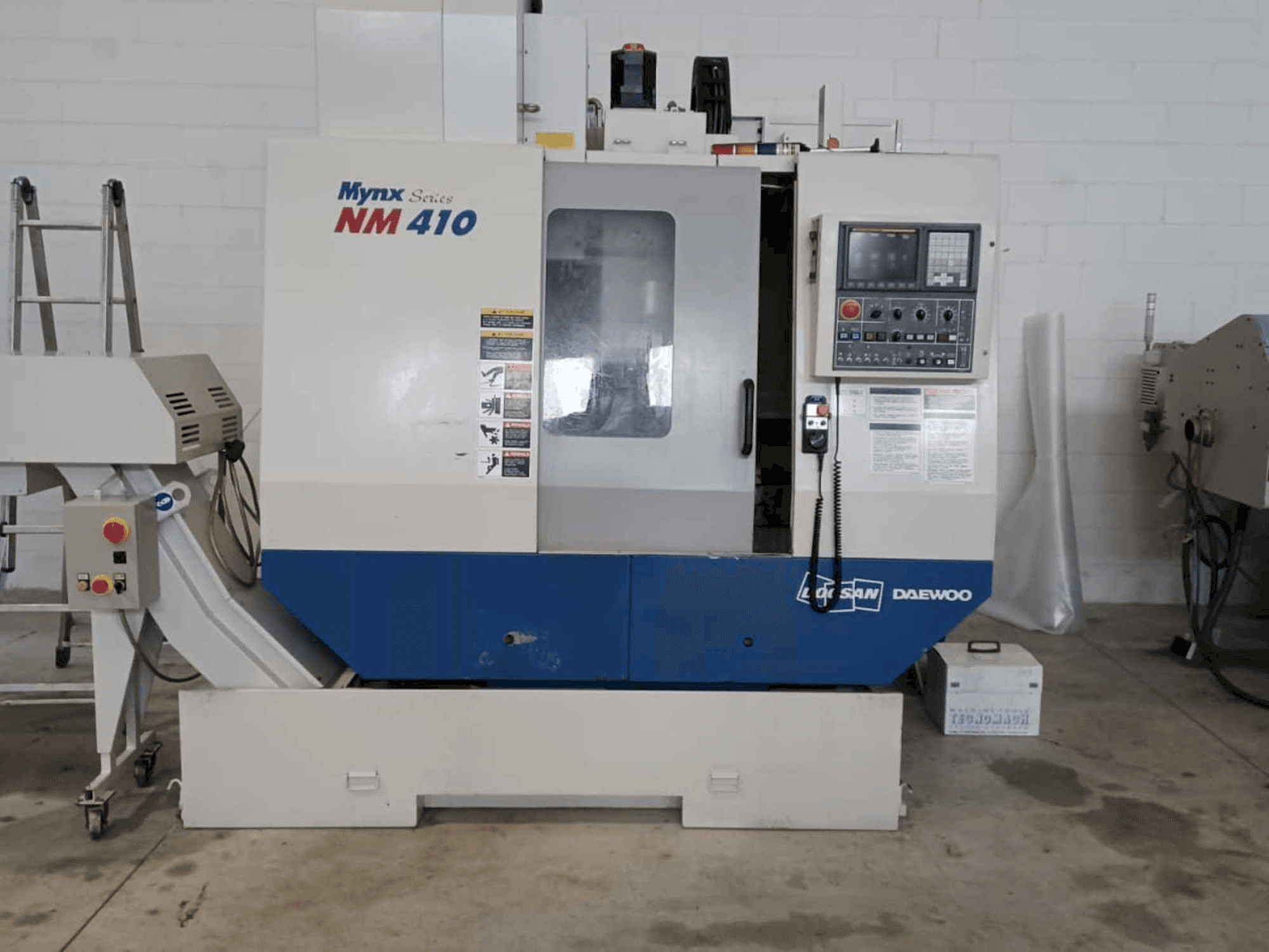 Mašīnas Doosan Mynx NM 410 pretskats
