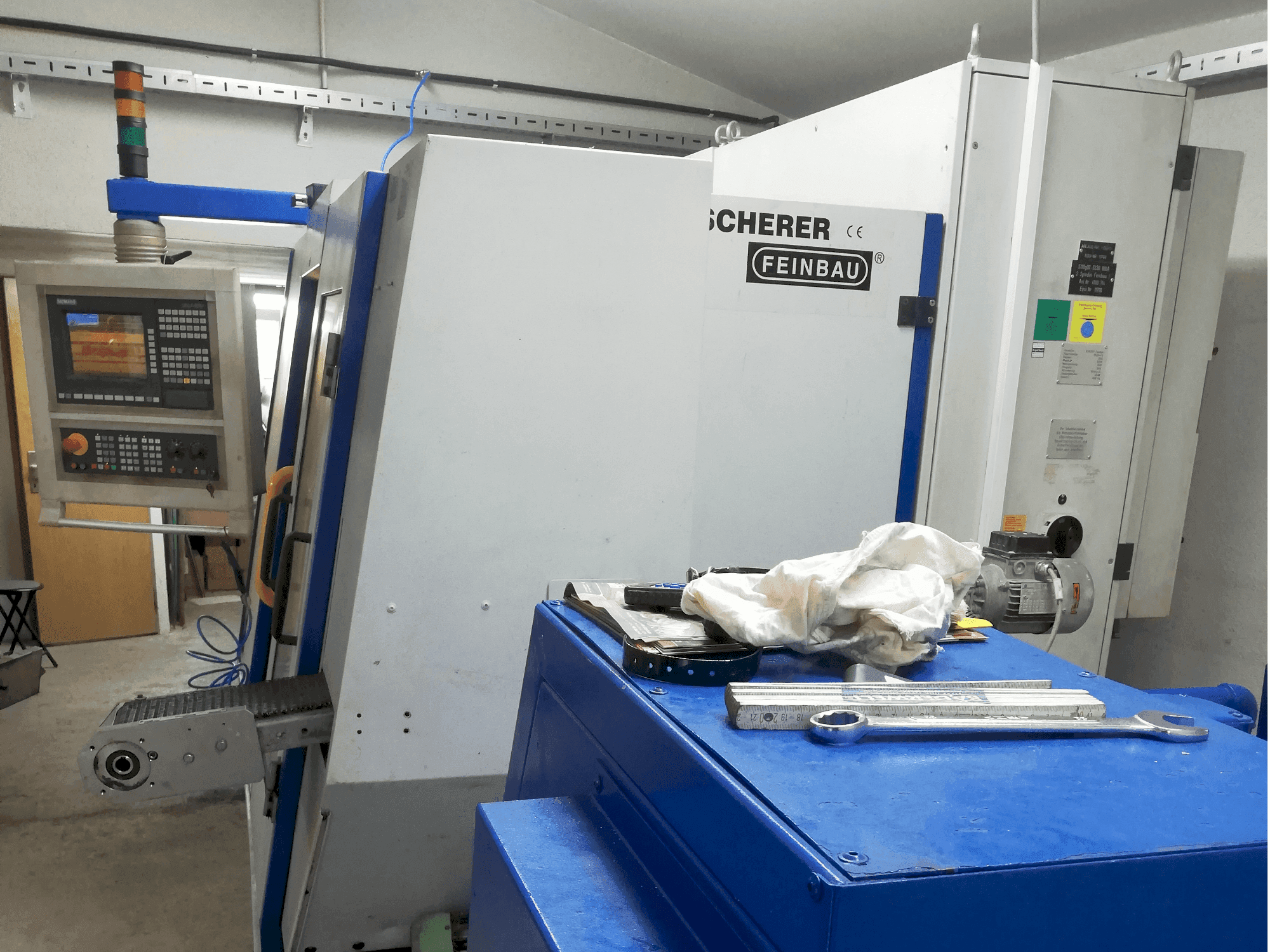 Mašīnas Scherer - Feinbau CNC244/2 pretskats