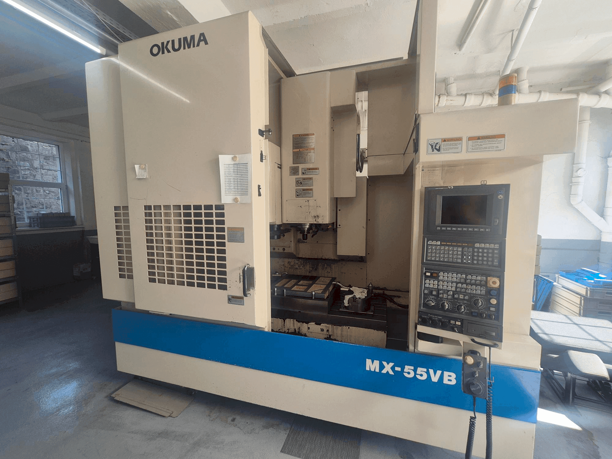 Mašīnas Okuma MX-55VB pretskats