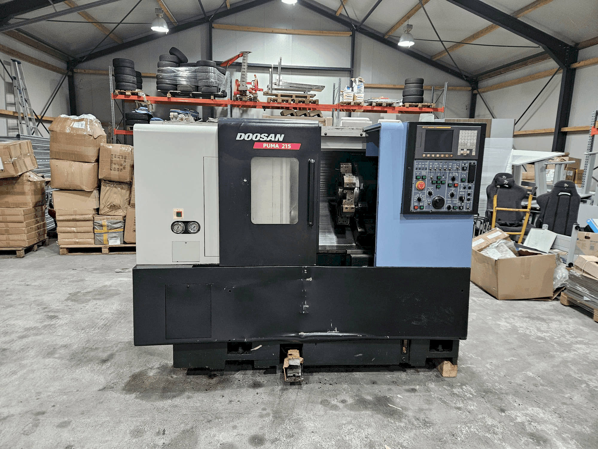 Mašīnas DOOSAN PUMA 215 pretskats