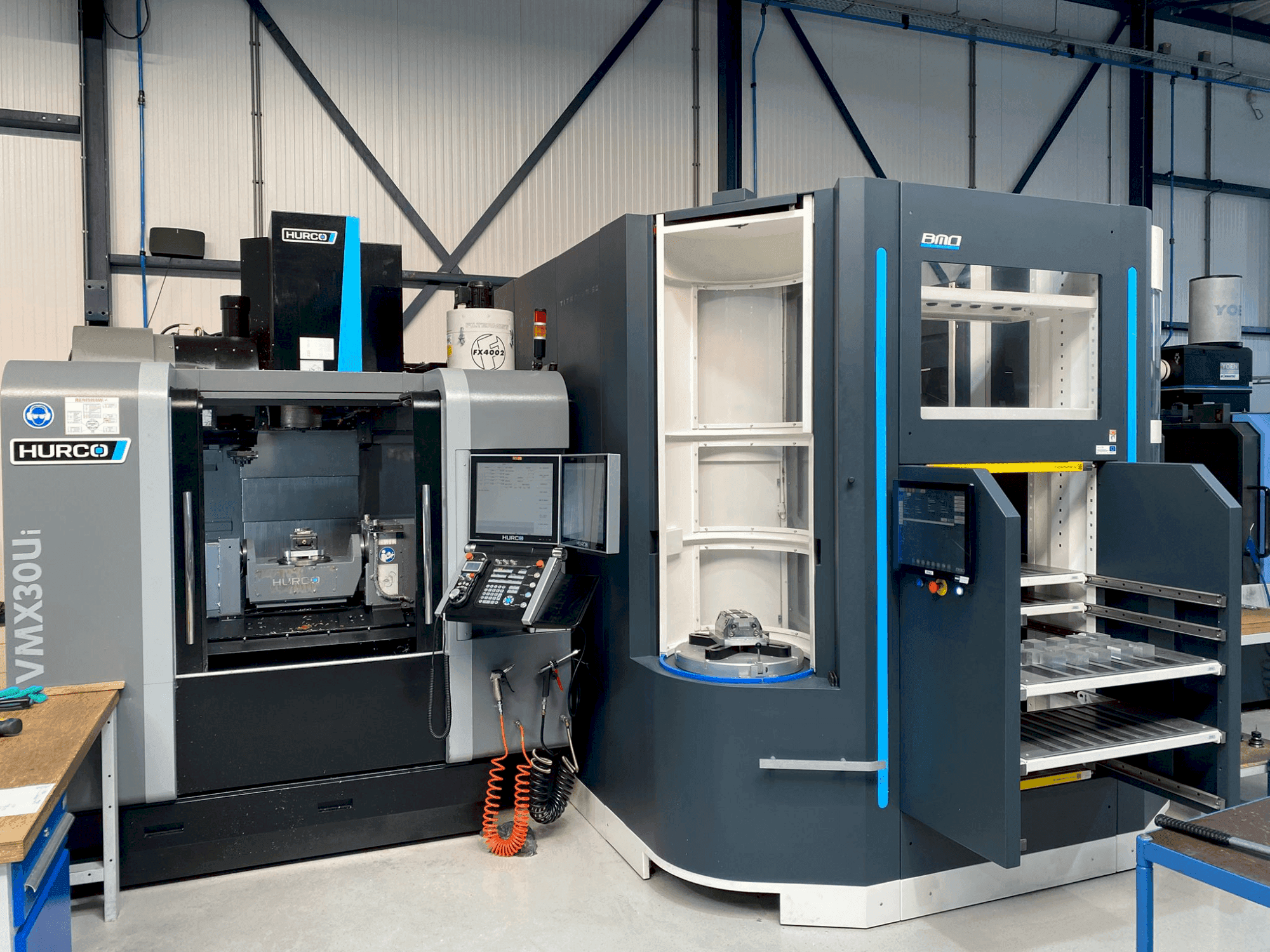 Mašīnas Hurco VMX30Ui + BMO Automation Titanium 50 pretskats