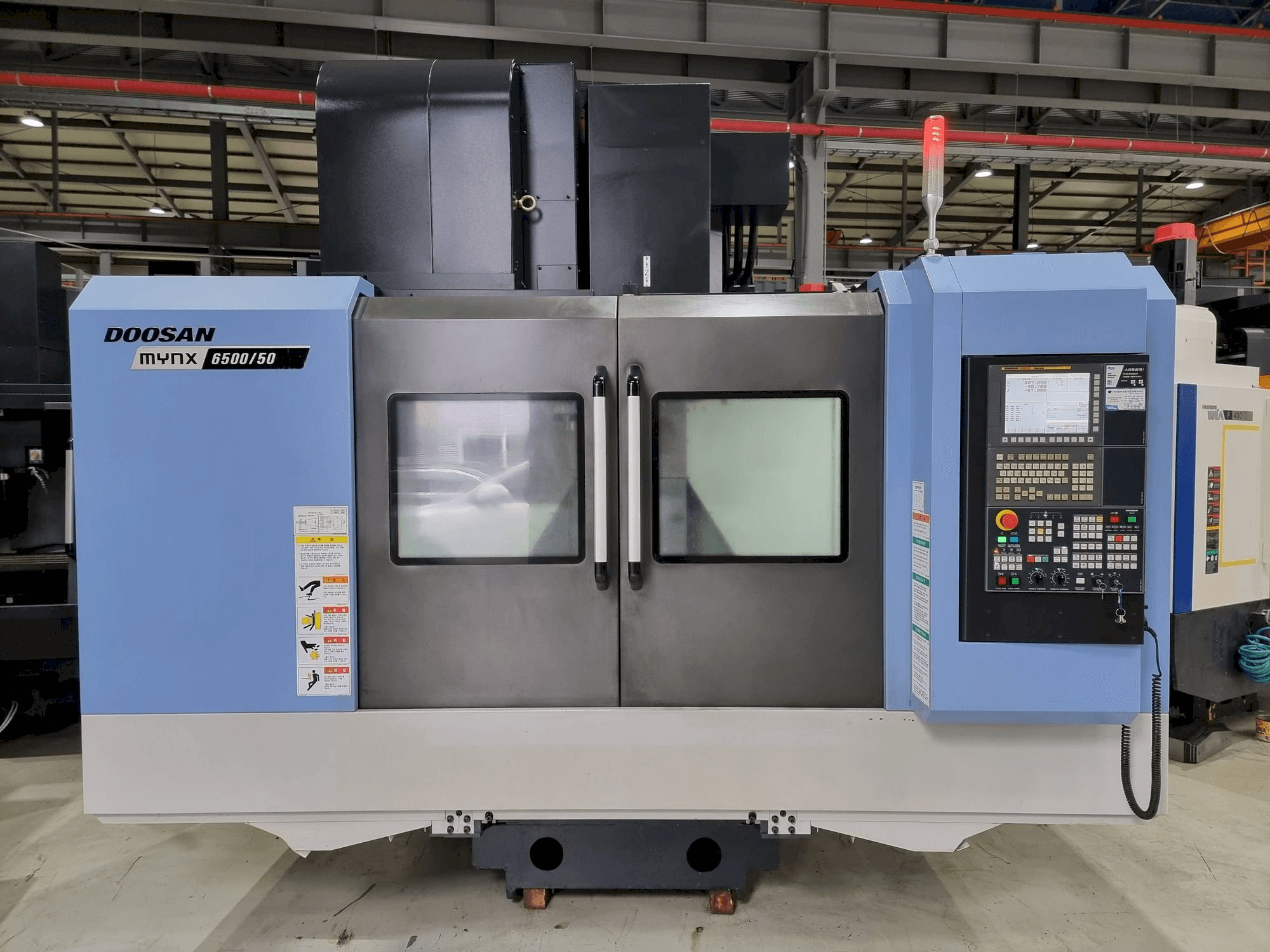 Mašīnas Doosan MYNX 6500/50 pretskats