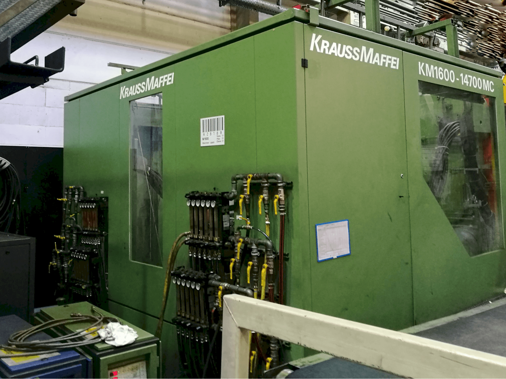 Mašīnas Krauss Maffei KM 1600-14700 MC skats no kreisās puses