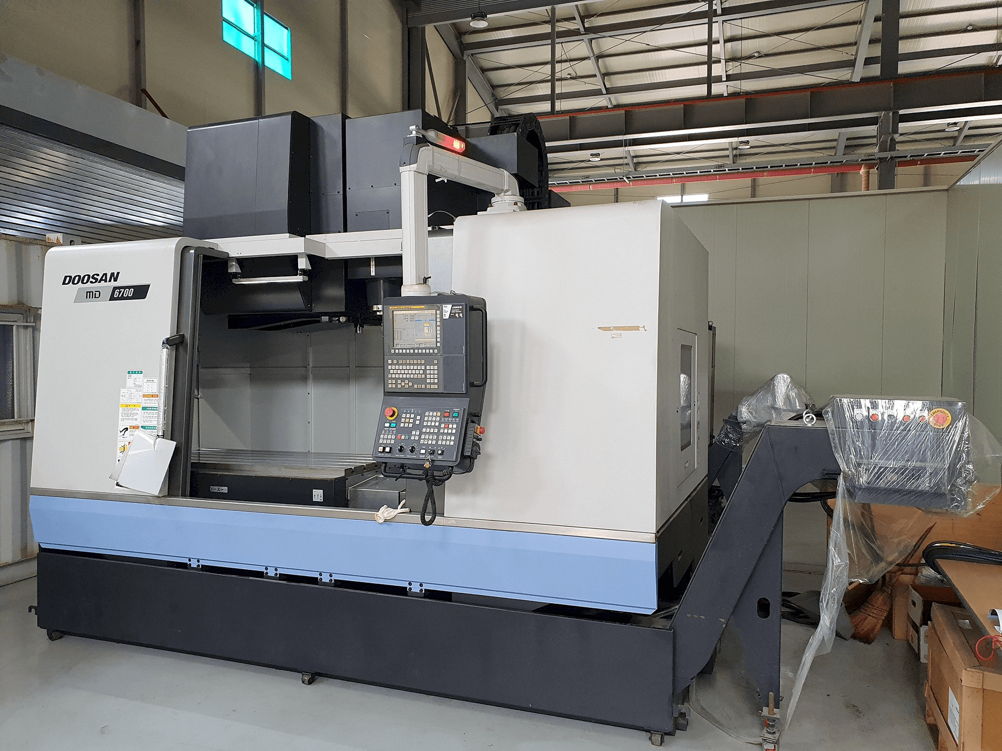 Mašīnas Doosan MD6700 pretskats