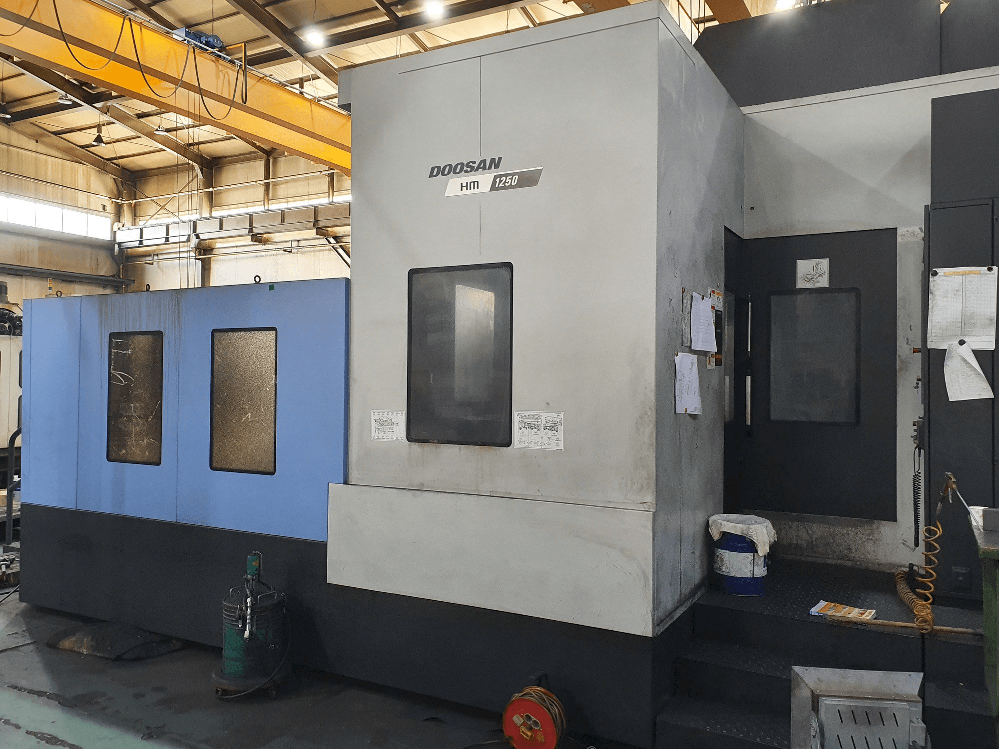 Mašīnas Doosan HM 1250 pretskats