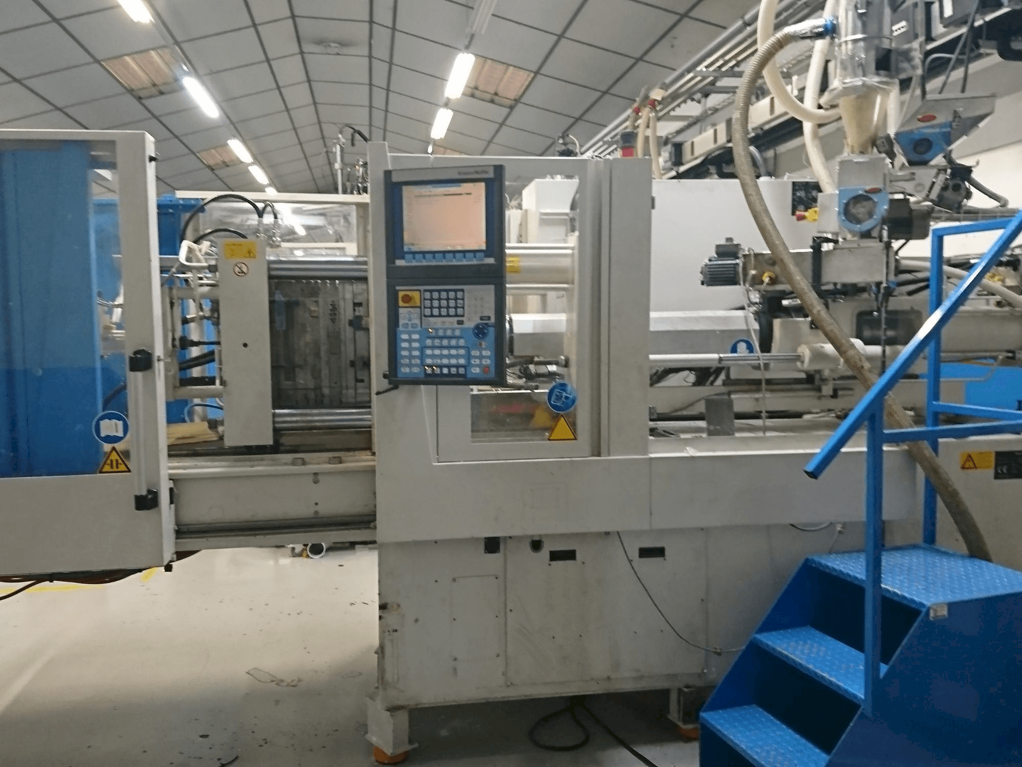 Mašīnas Krauss Maffei 80-750 CX pretskats