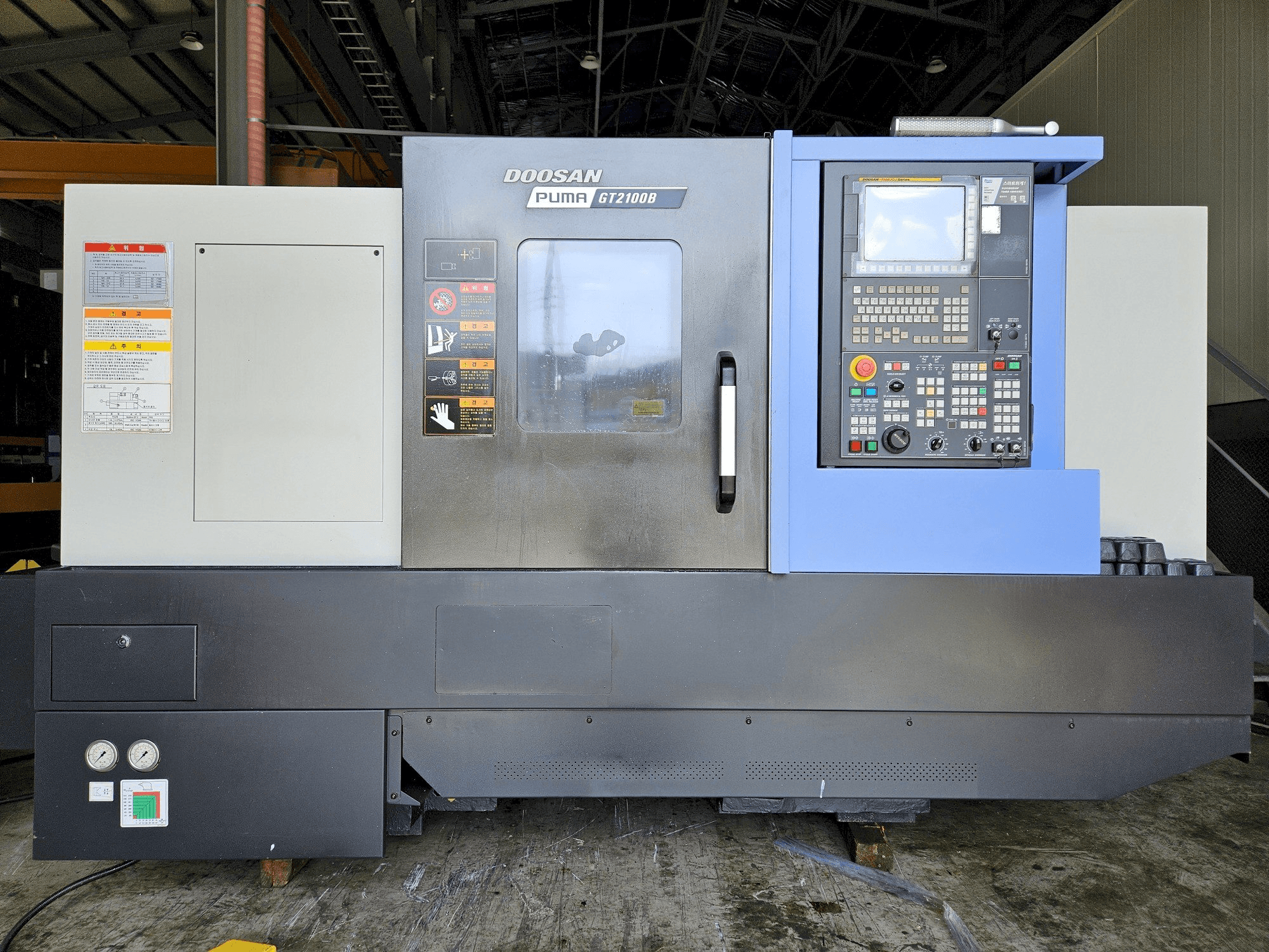 Mašīnas DOOSAN GT2100B pretskats