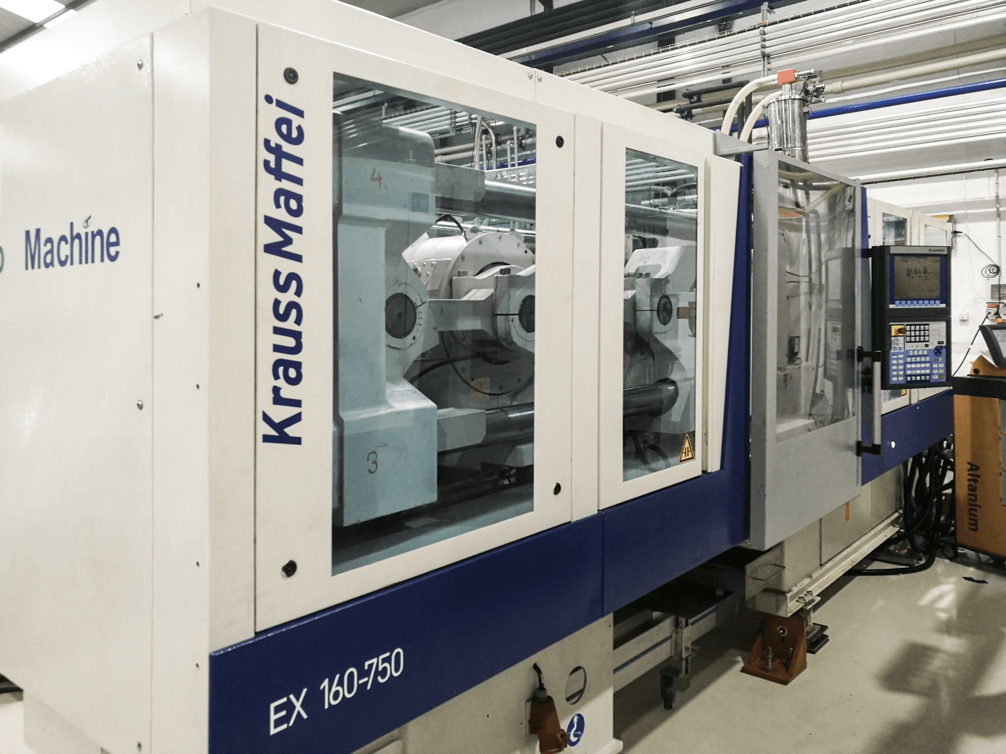 Mašīnas Krauss Maffei 160-750 EX skats no kreisās puses