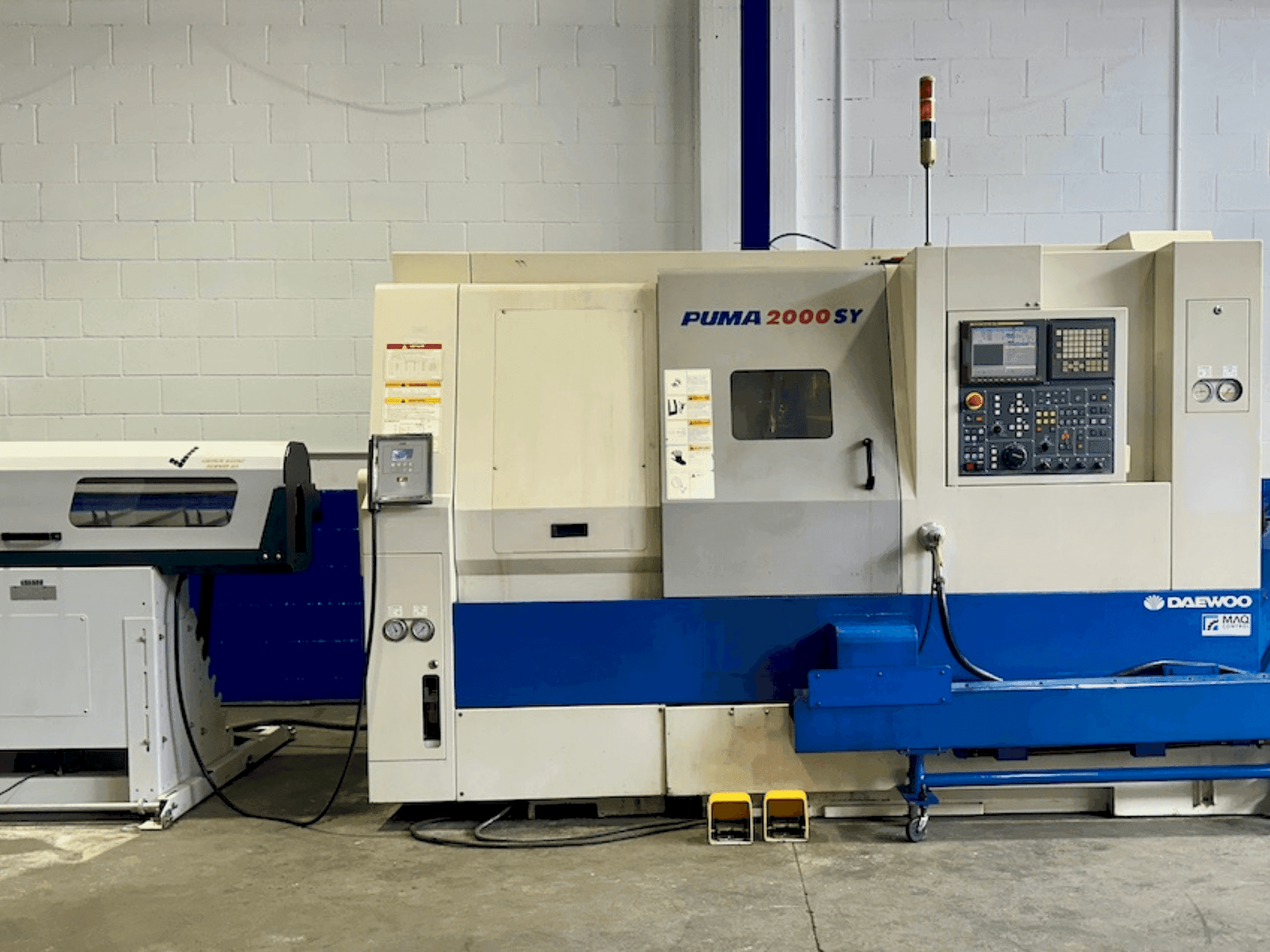 Mašīnas DOOSAN PUMA 2000SY pretskats