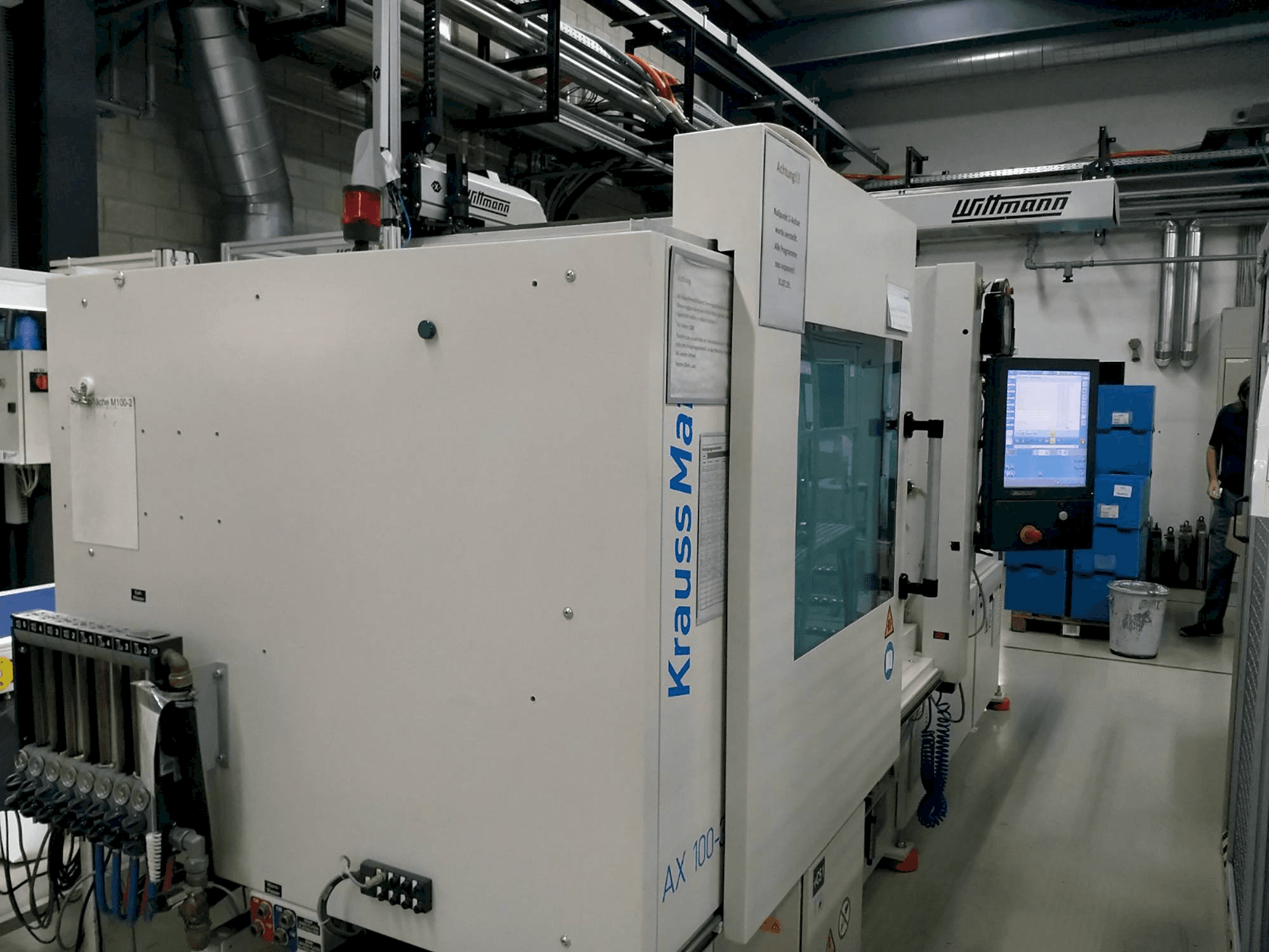 Mašīnas Krauss Maffei 100-380 AX pretskats