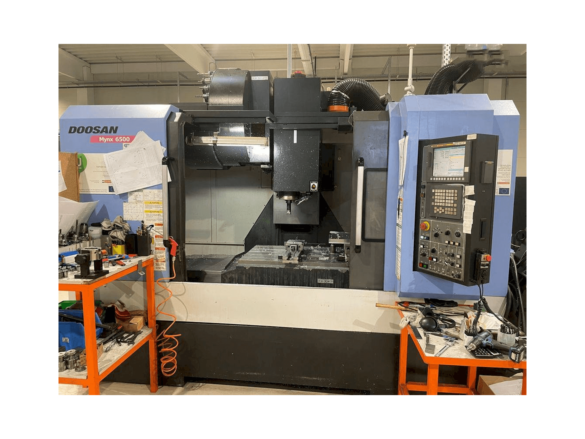 Mašīnas Doosan MYNX DNM 6500 pretskats
