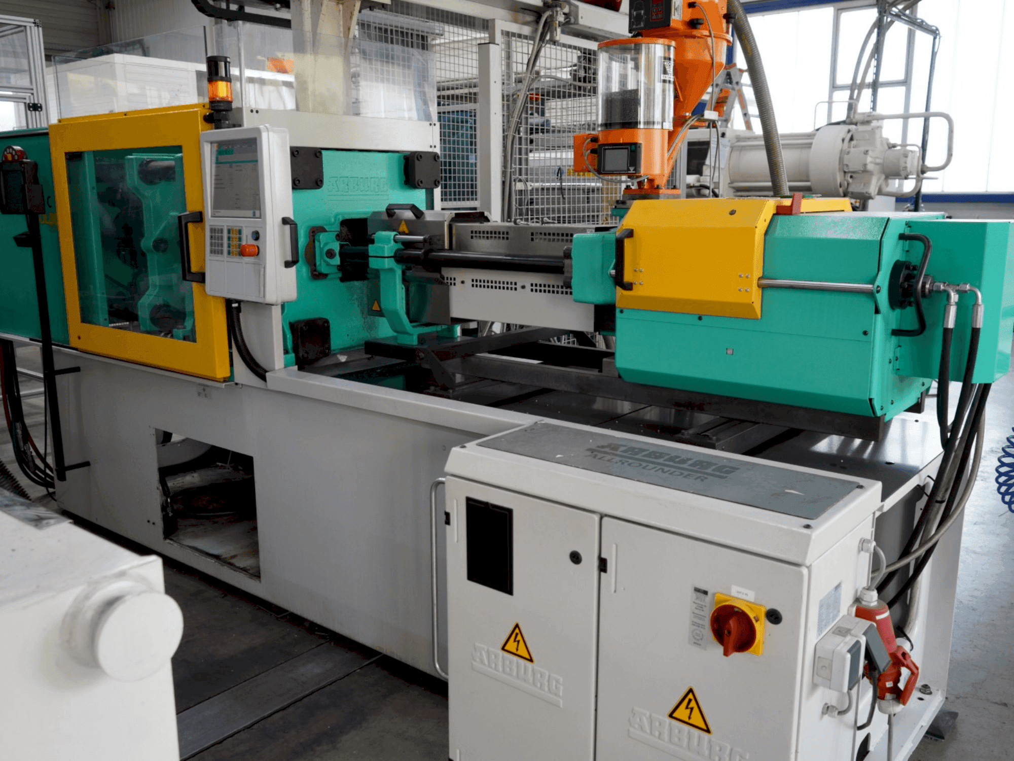 Mašīnas Arburg 470C 1500-400 pretskats