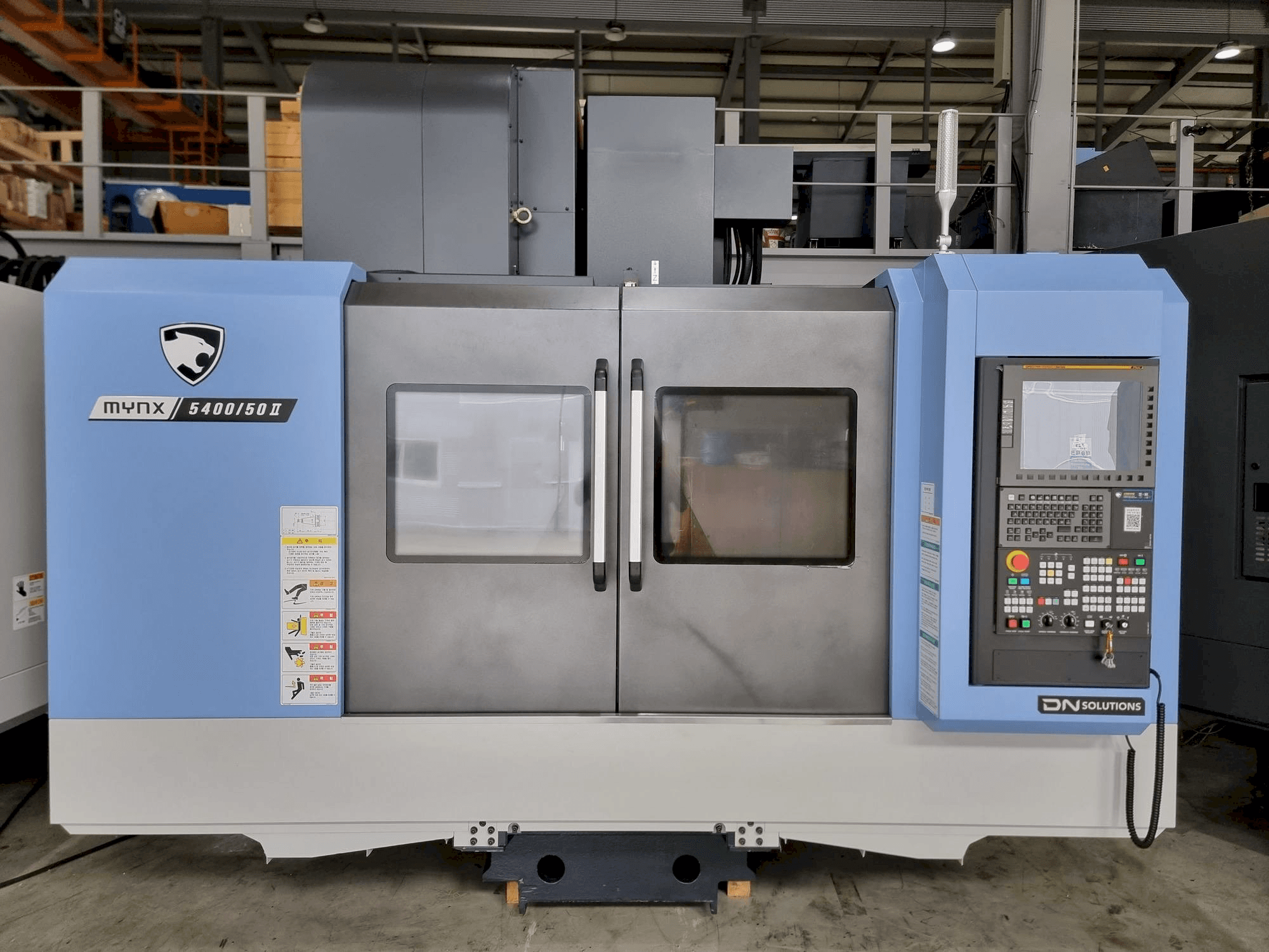 Mašīnas DOOSAN MYNX 5400/50 pretskats