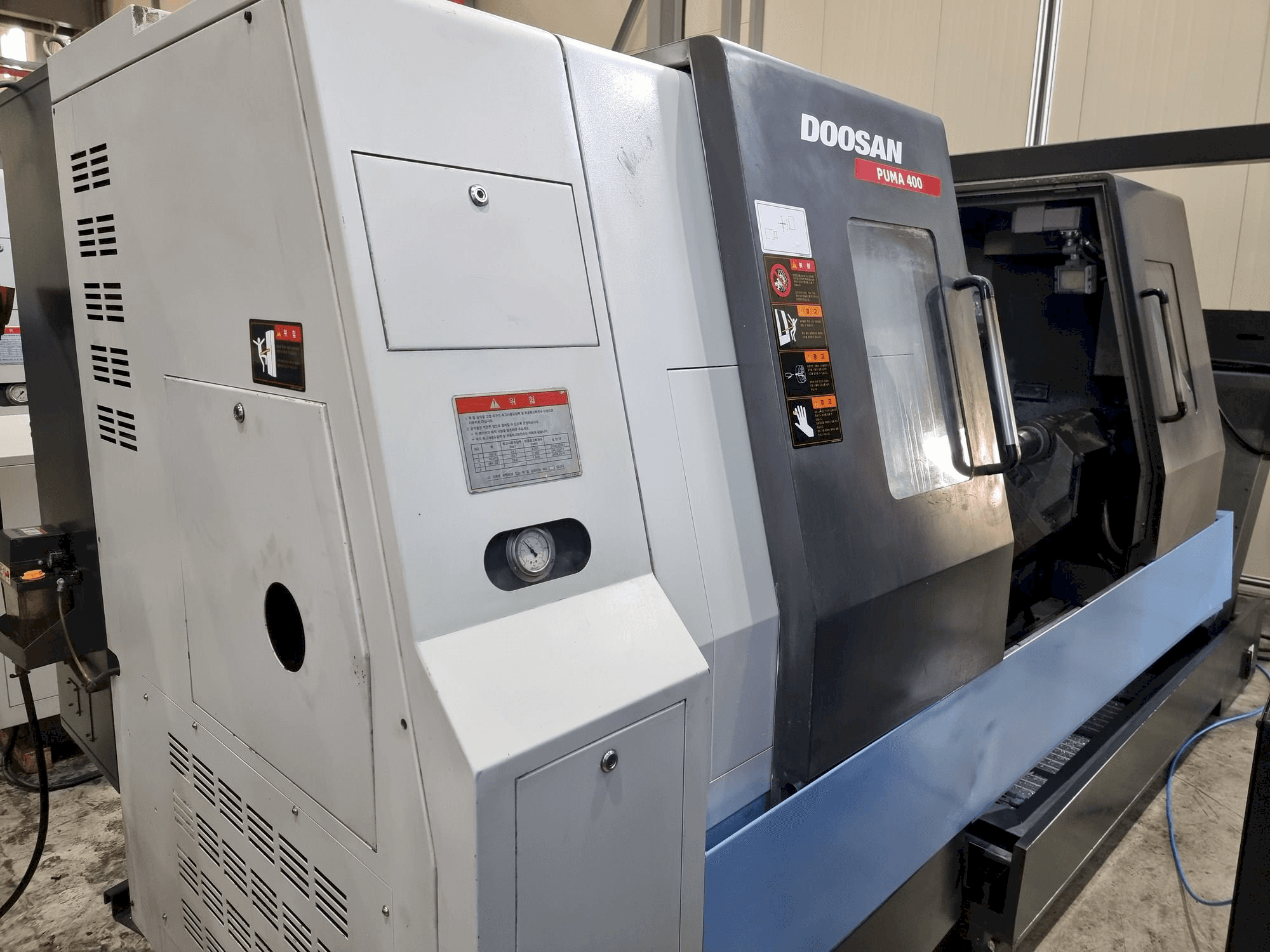 Mašīnas Doosan PUMA 400B pretskats