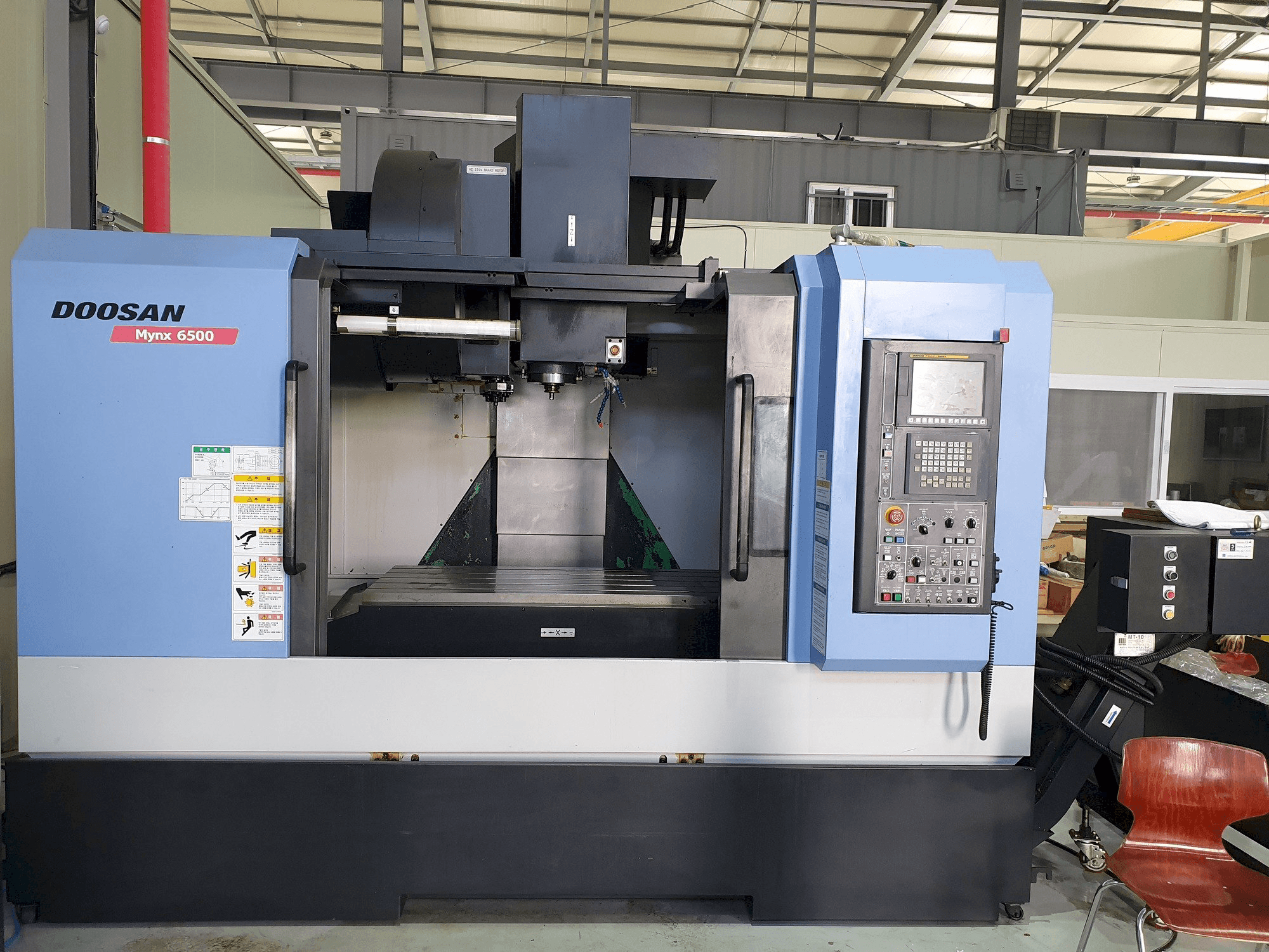 Mašīnas Doosan MYNX 6500 pretskats