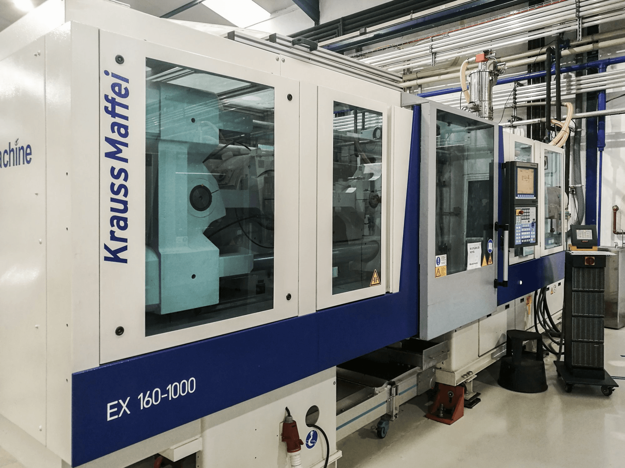 Mašīnas Krauss Maffei 160-1000 EX skats no kreisās puses