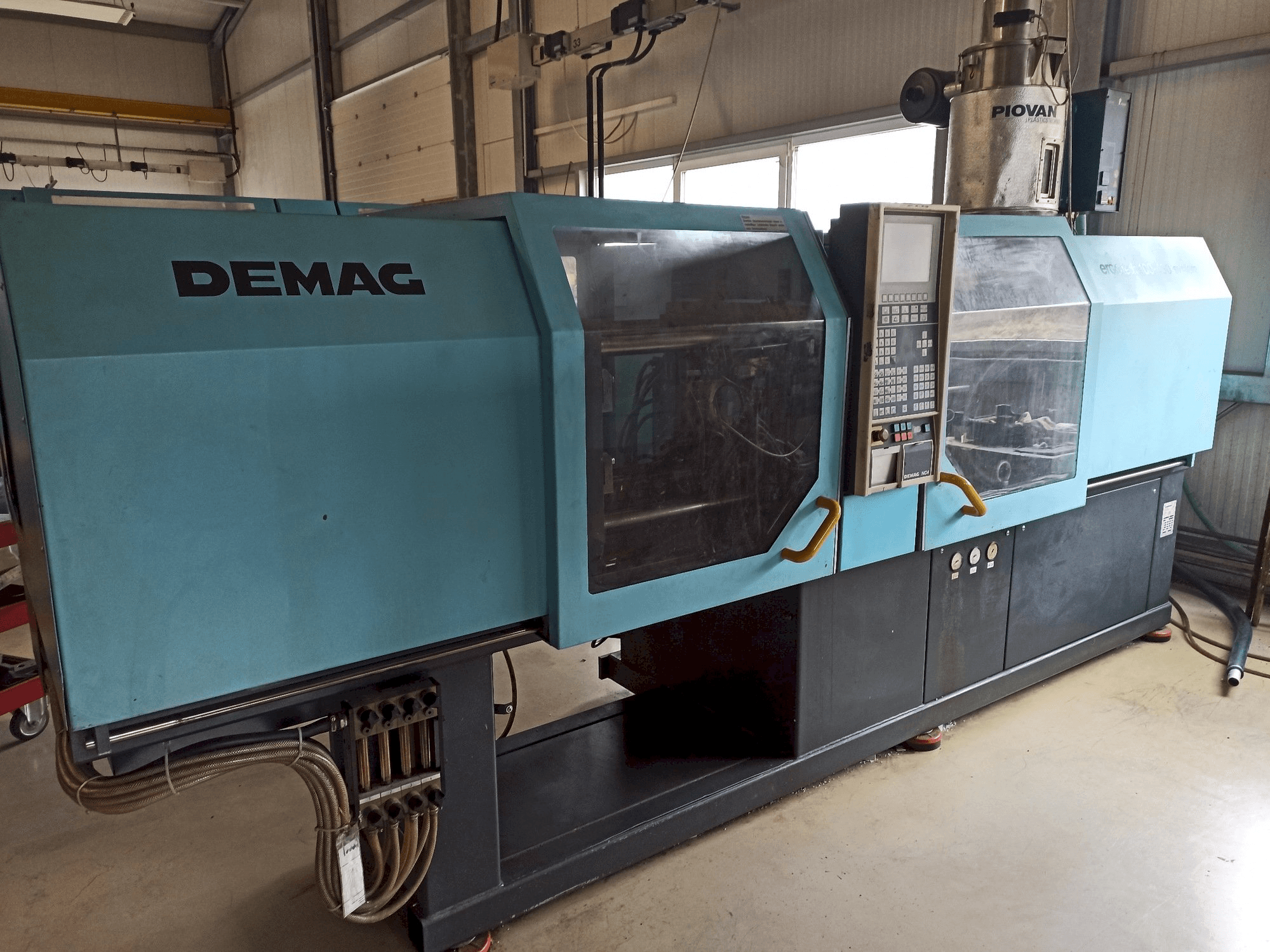 Mašīnas DEMAG Ergotech 150-610 Compact kreisās malas skats