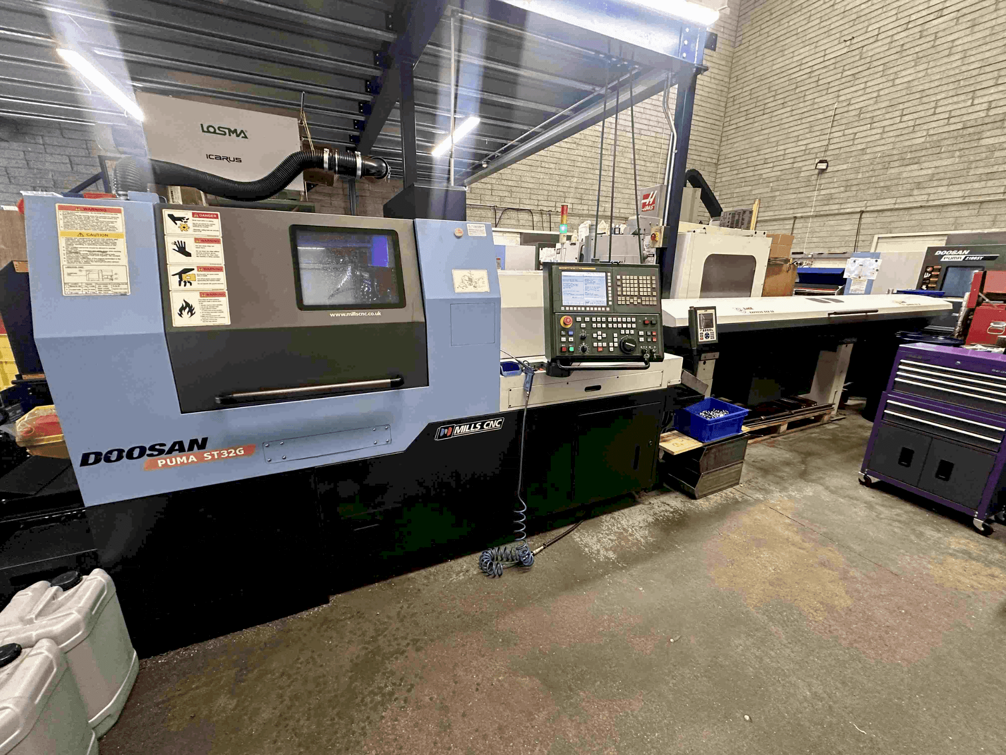 Mašīnas DOOSAN Puma ST32G pretskats
