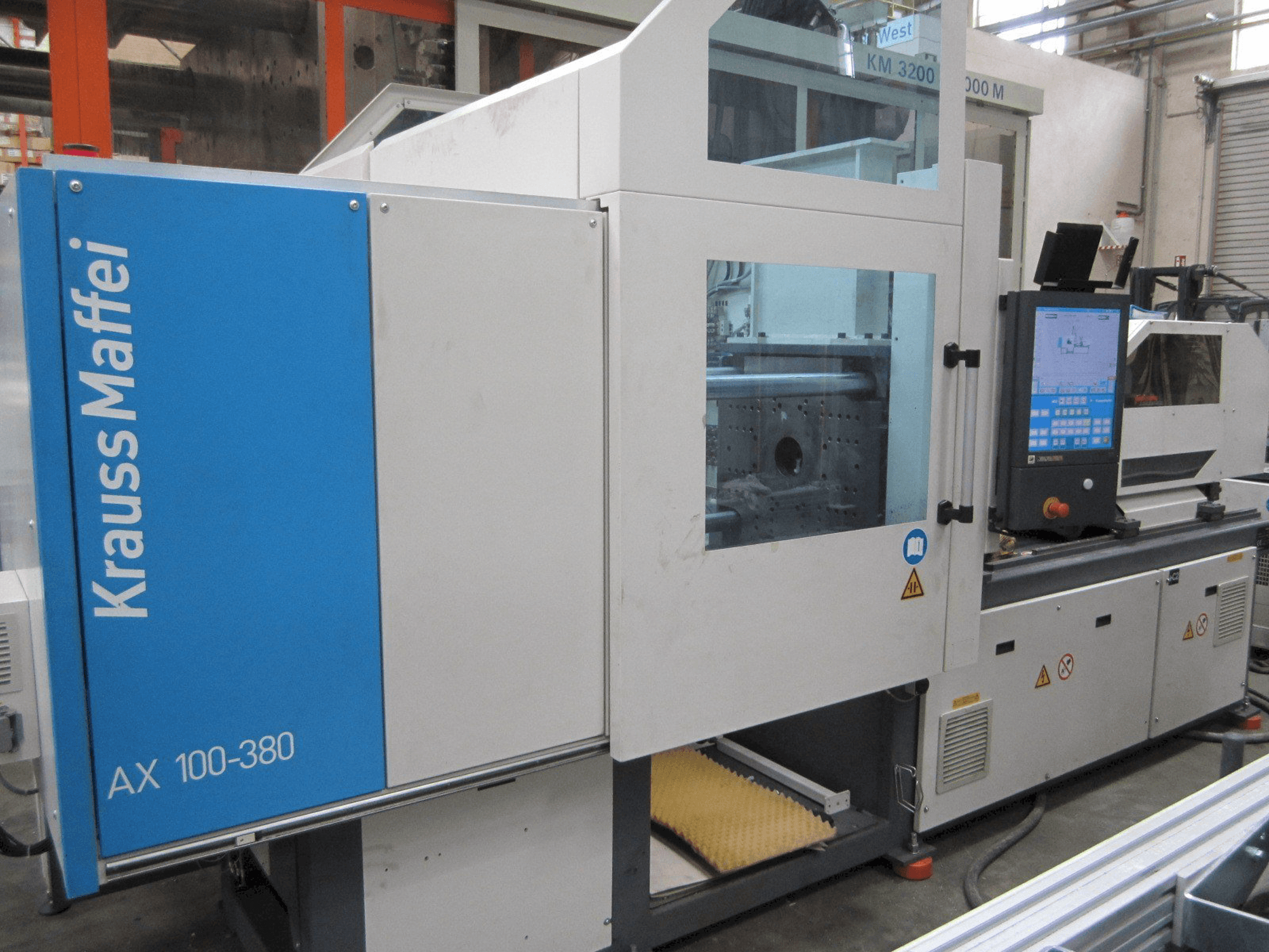 Mašīnas Krauss Maffei 100-380 AX pretskats