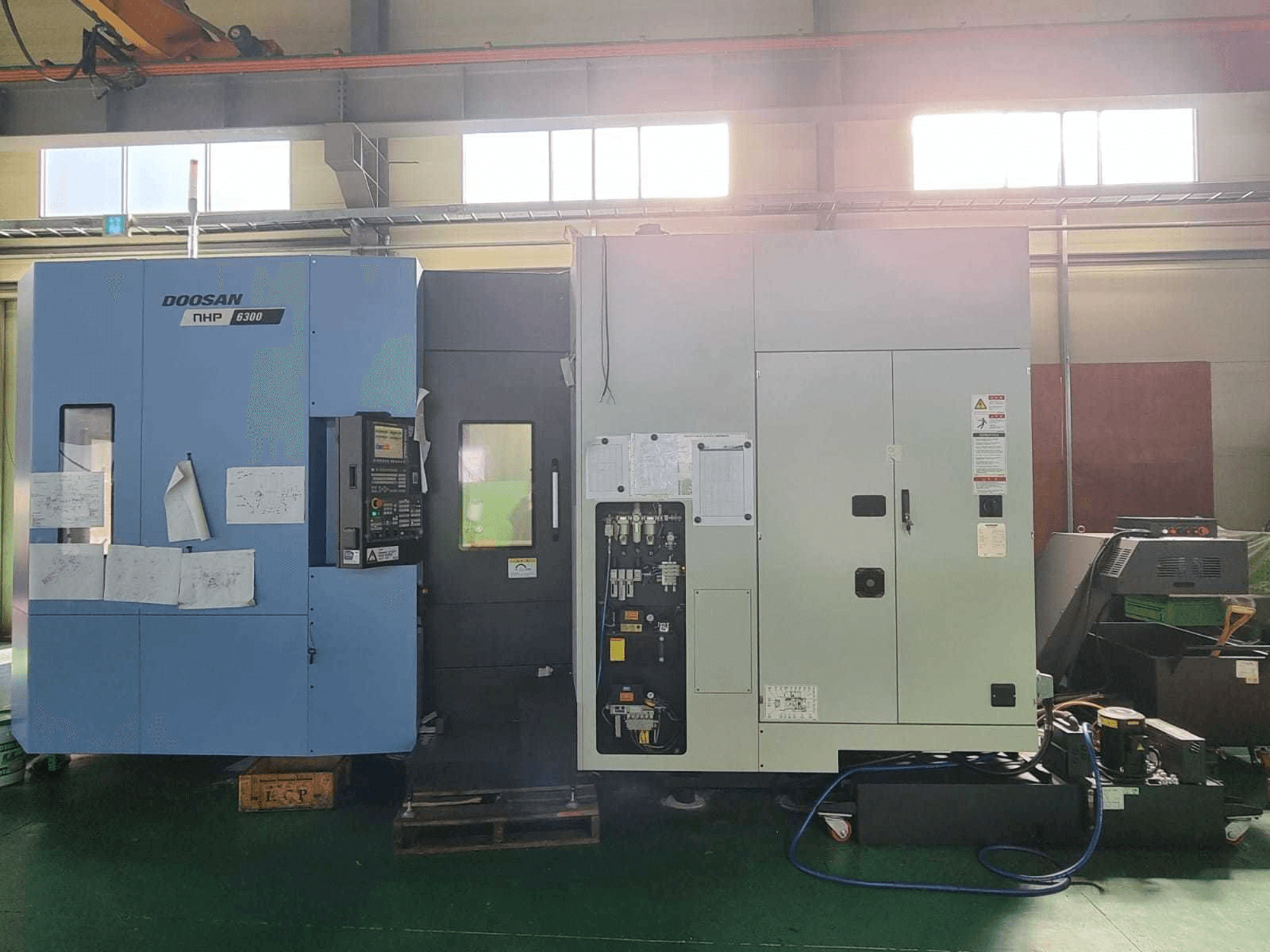 Mašīnas Doosan NHP 6300 pretskats