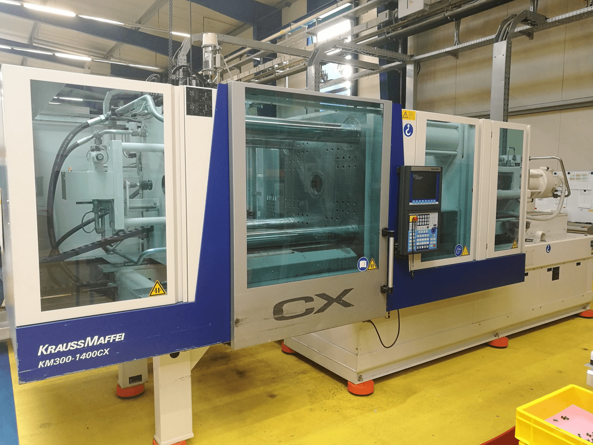 Mašīnas Krauss Maffei 300-1400 CX pretskats