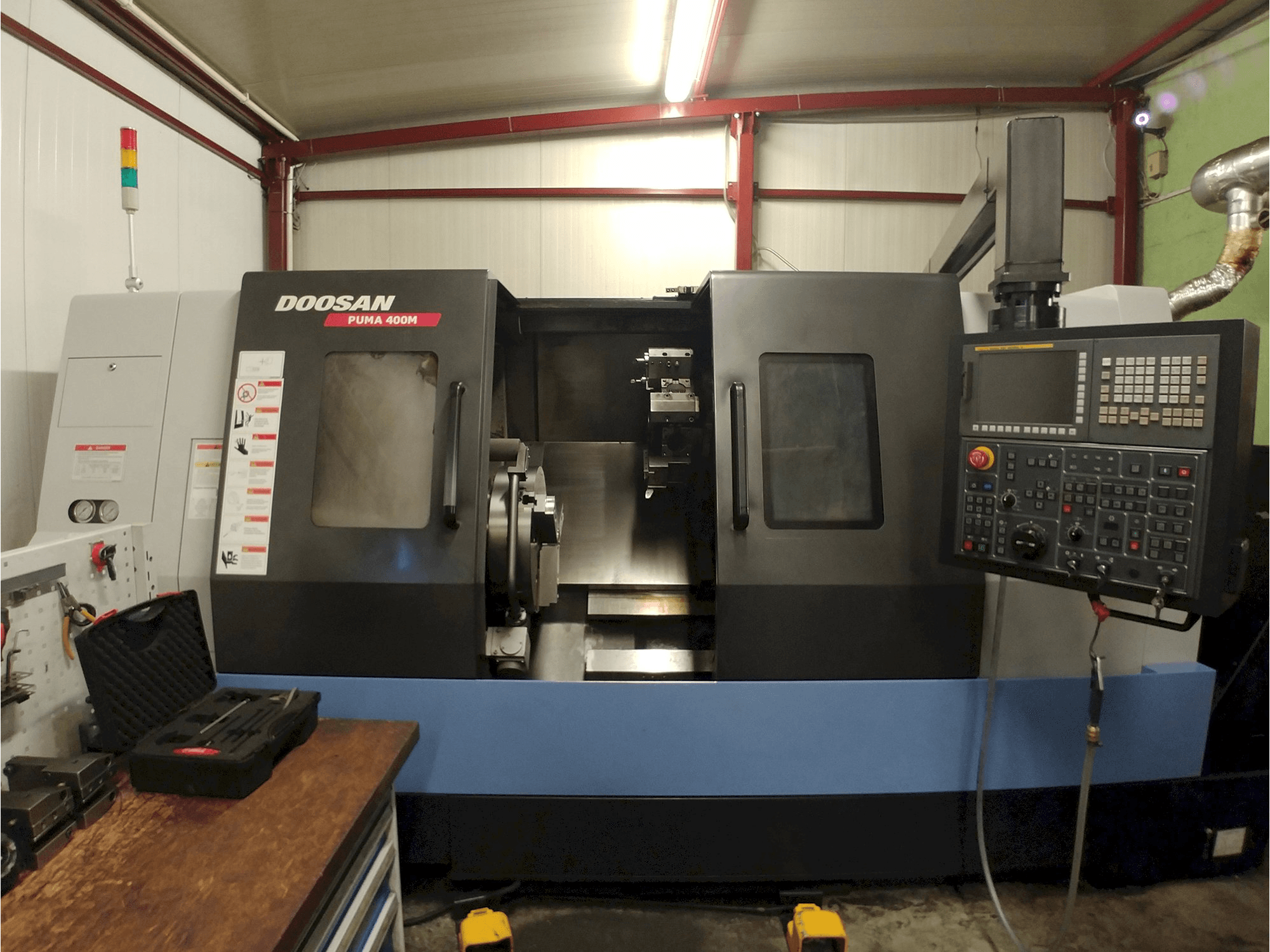 Mašīnas Doosan Puma 400MC pretskats