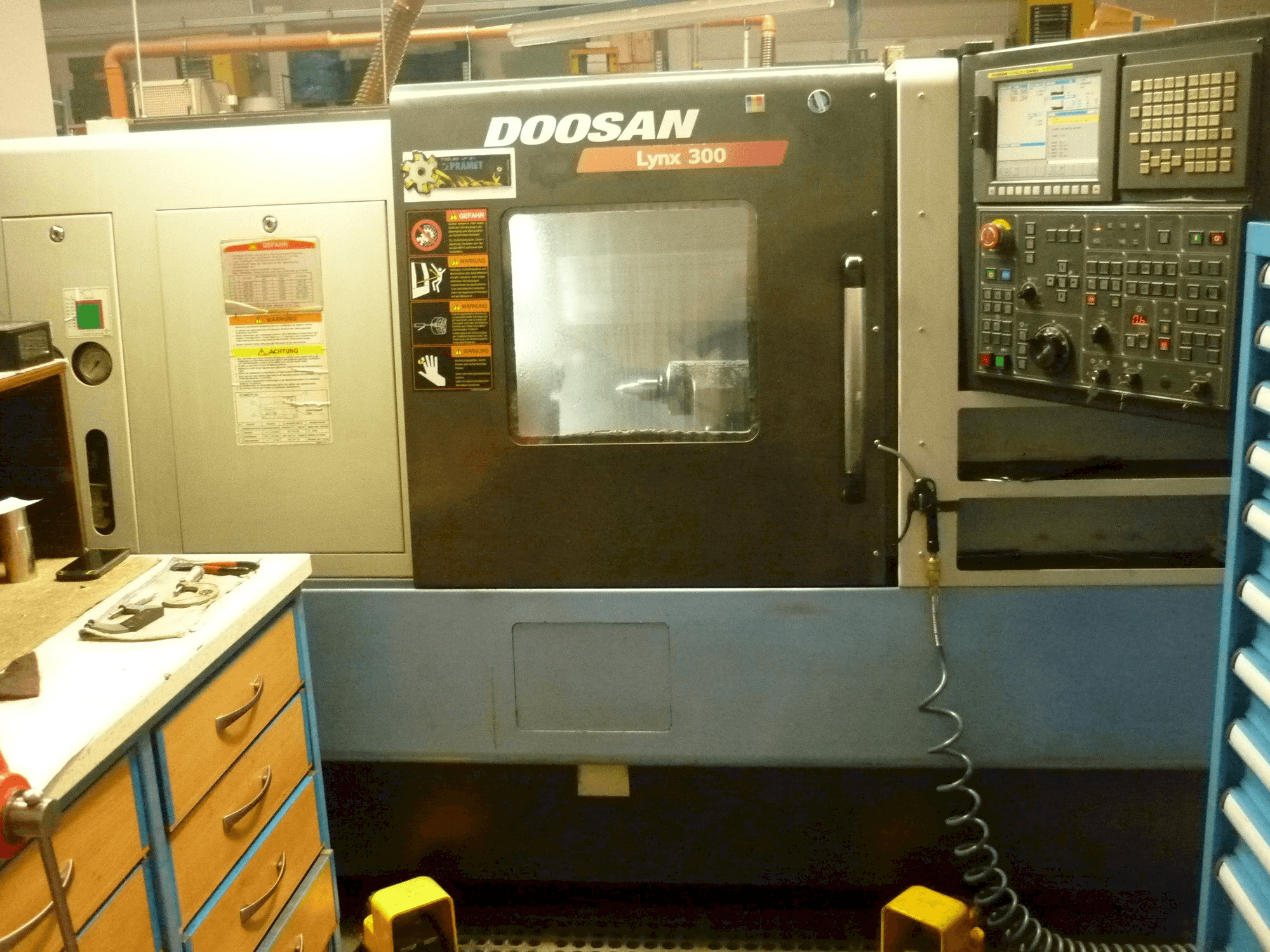Mašīnas Doosan LYNX 300 pretskats