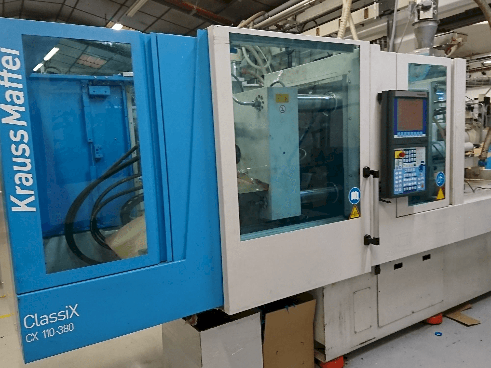 Mašīnas Krauss Maffei 110-380 CX pretskats