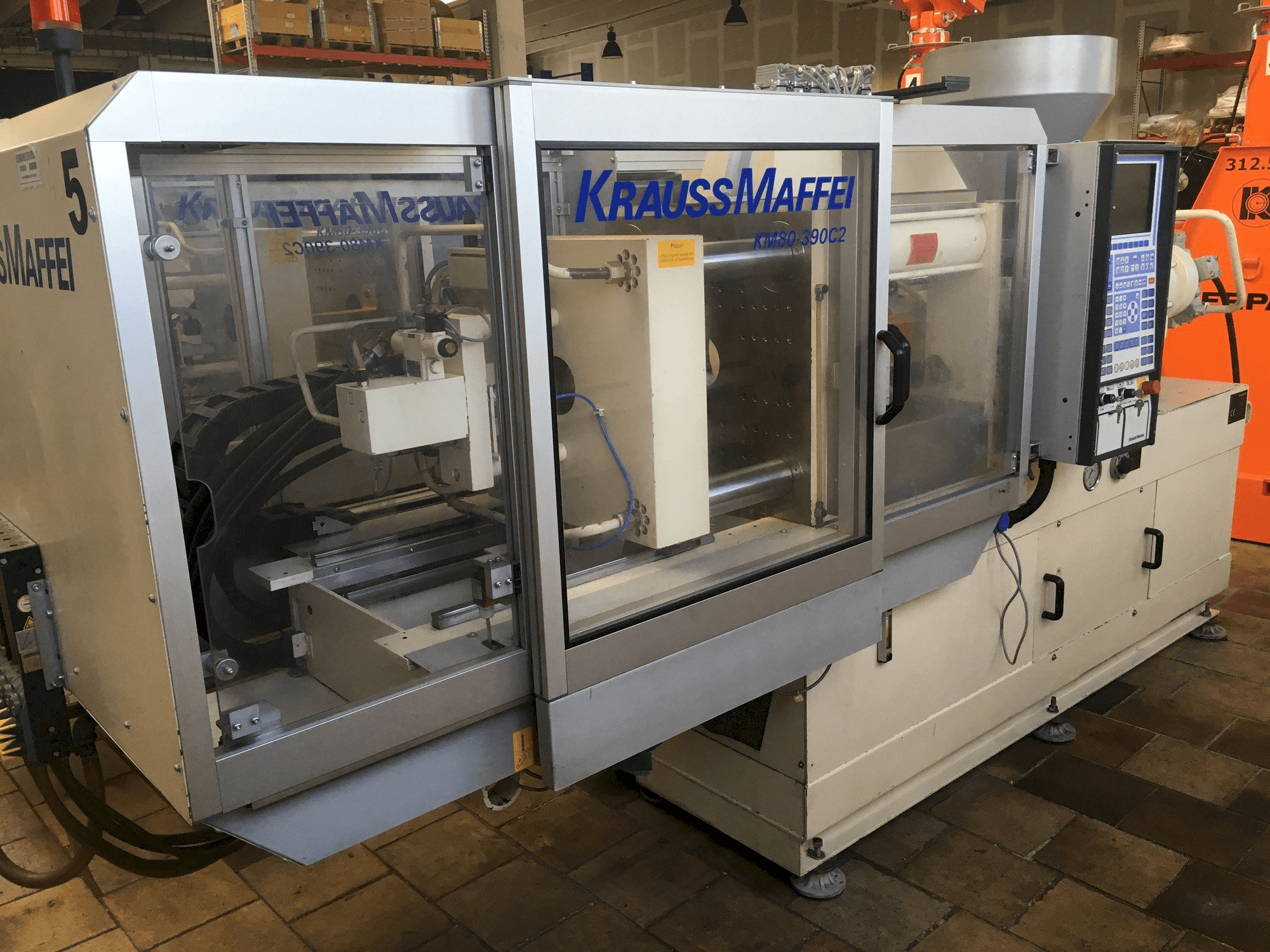 Mašīnas Krauss Maffei 80/390 C2 pretskats