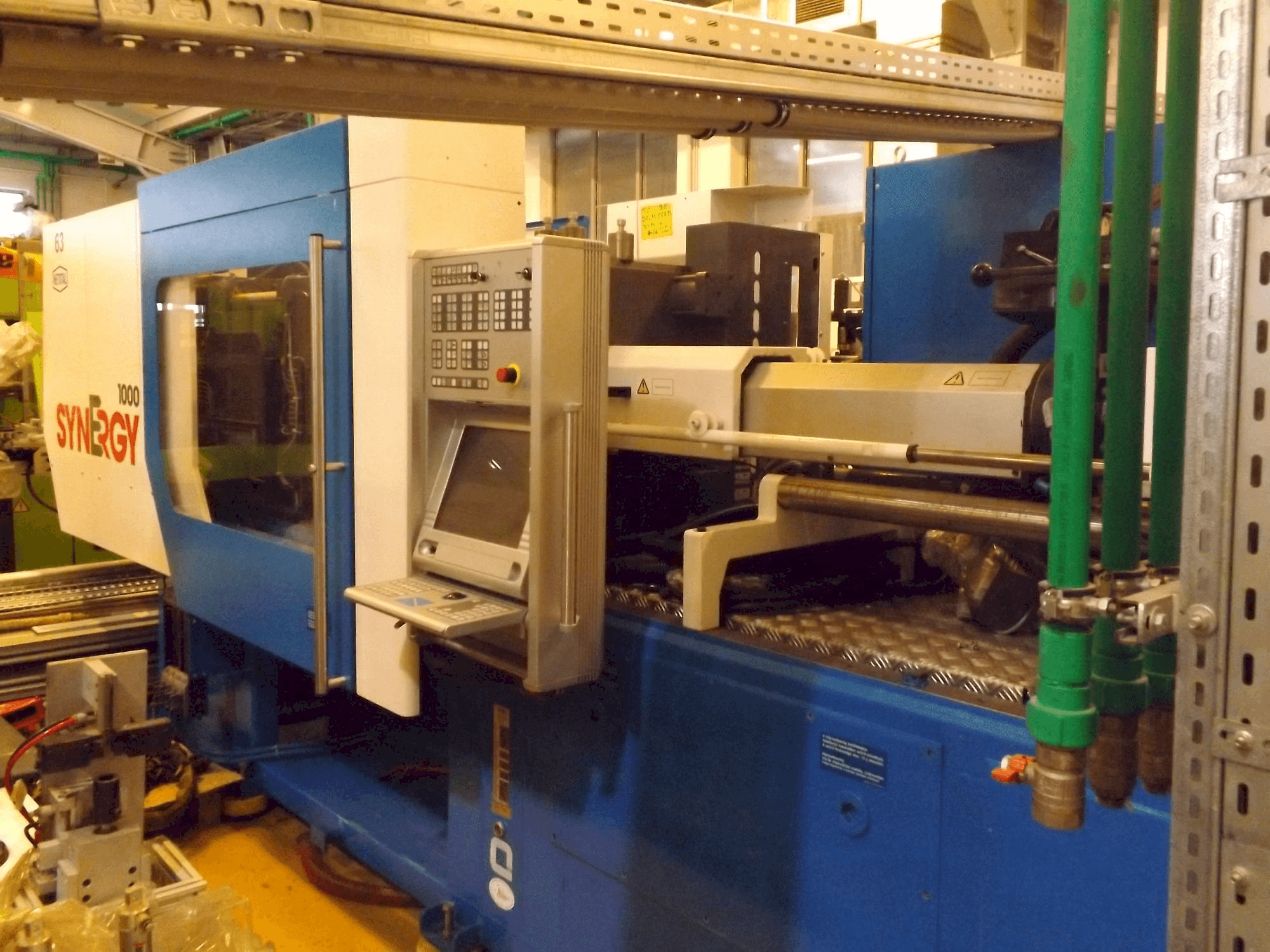 Mašīnas Netstal Synergy 1000 230-110 pretskats