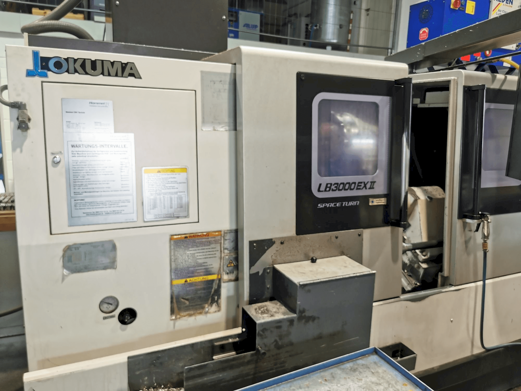 Mašīnas Okuma LB3000ll EX MC 1000 pretskats