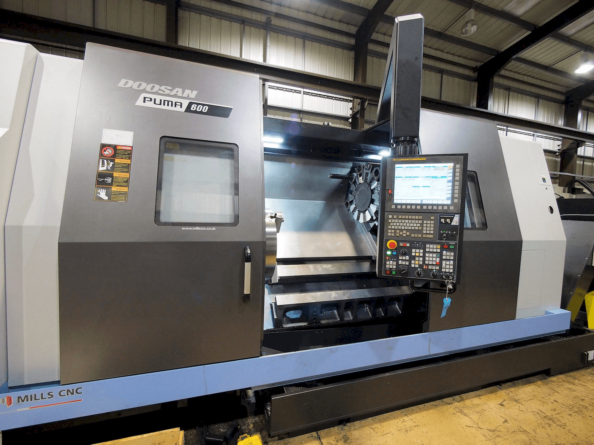 Mašīnas Doosan Puma 600 pretskats