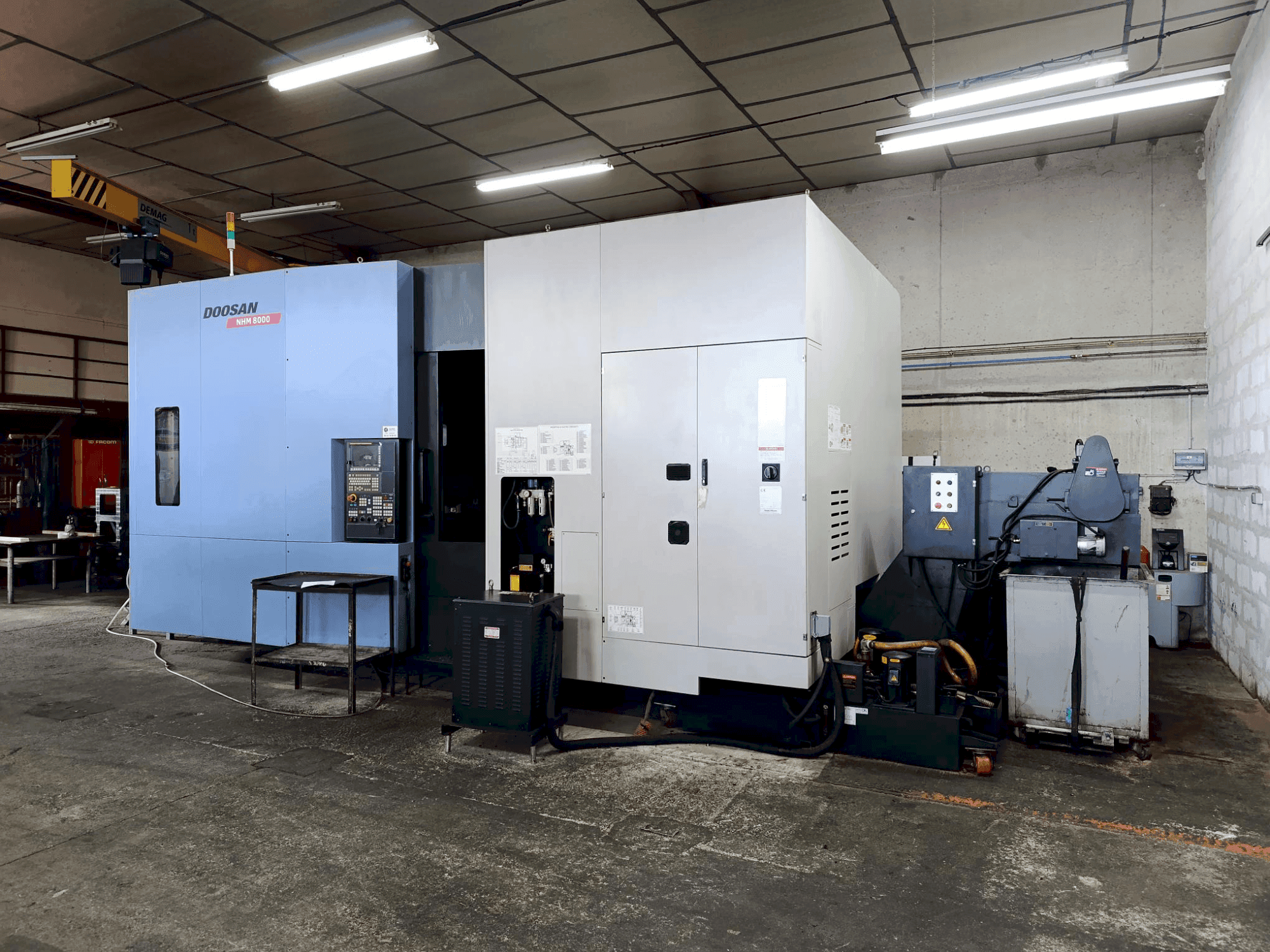 Mašīnas DOOSAN HM 8000 pretskats