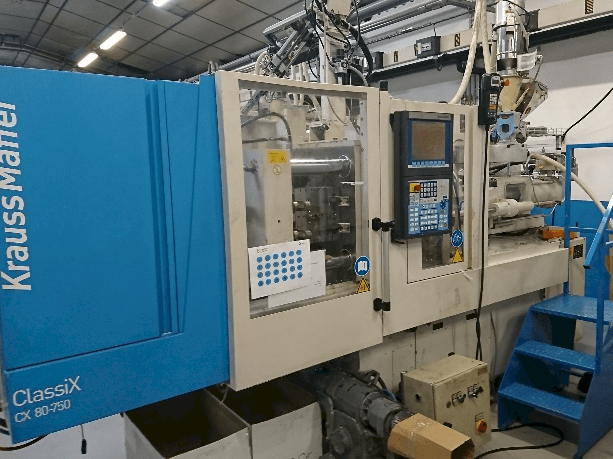 Mašīnas Krauss Maffei 80-750 CX pretskats