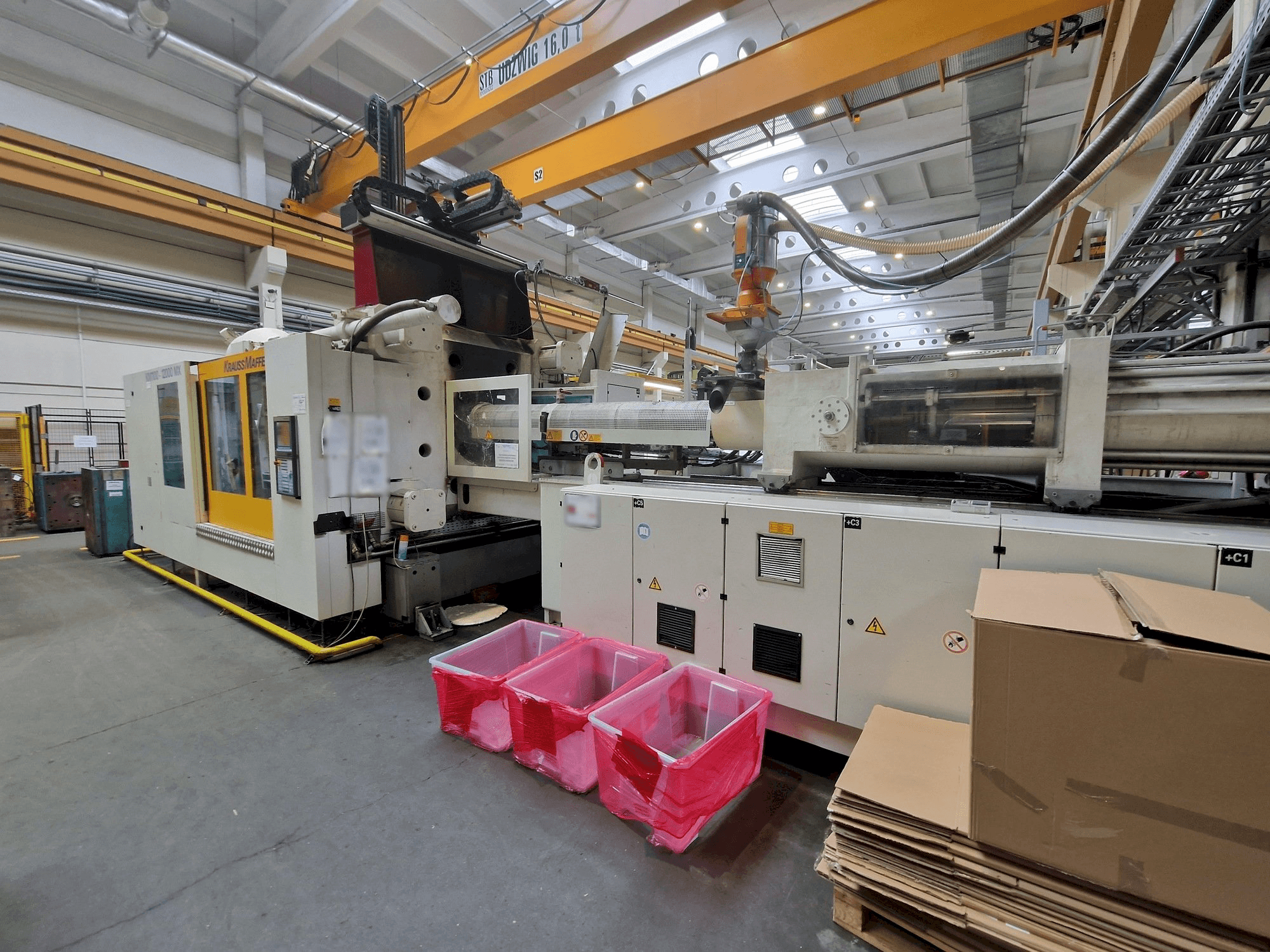 Mašīnas Krauss Maffei 1100-12000 MX pretskats