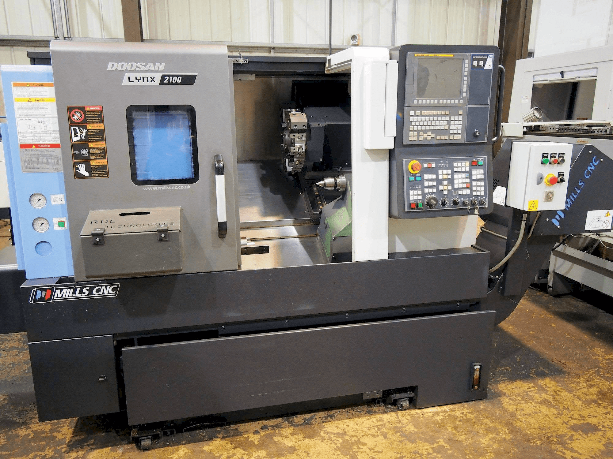 Mašīnas Doosan Lynx 2100B pretskats