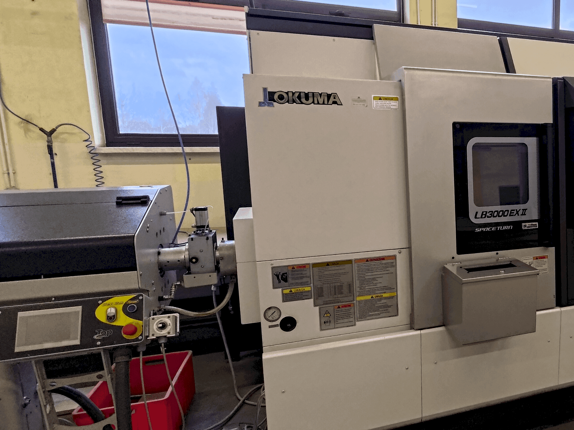 Mašīnas Okuma LB 3000 EXII MYW 450 pretskats