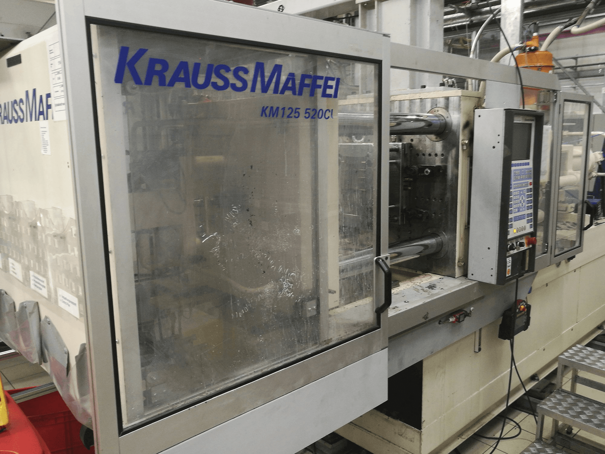 Mašīnas Krauss Maffei KM 125-520 C1 pretskats