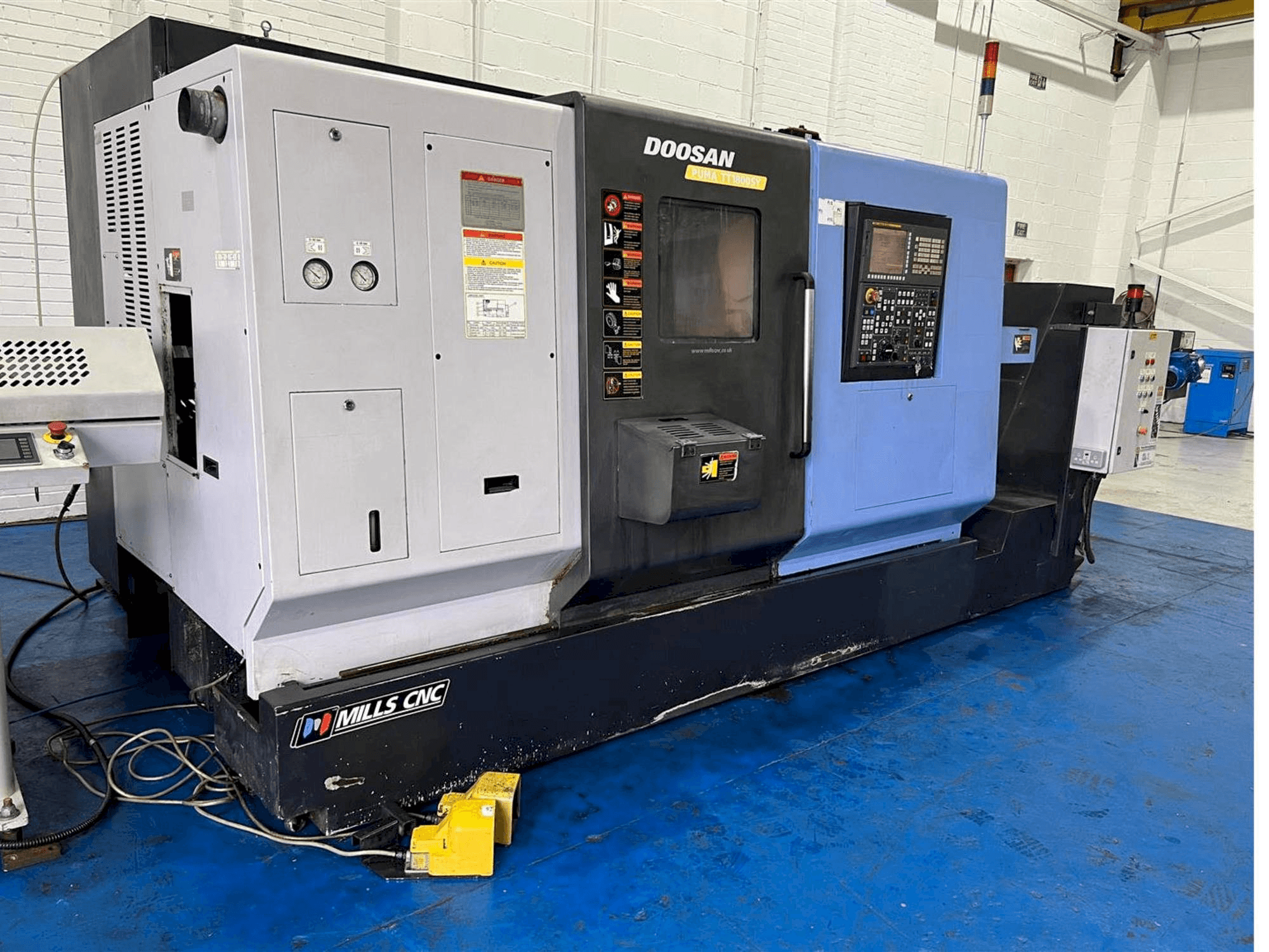 Mašīnas Doosan TT1800SY pretskats